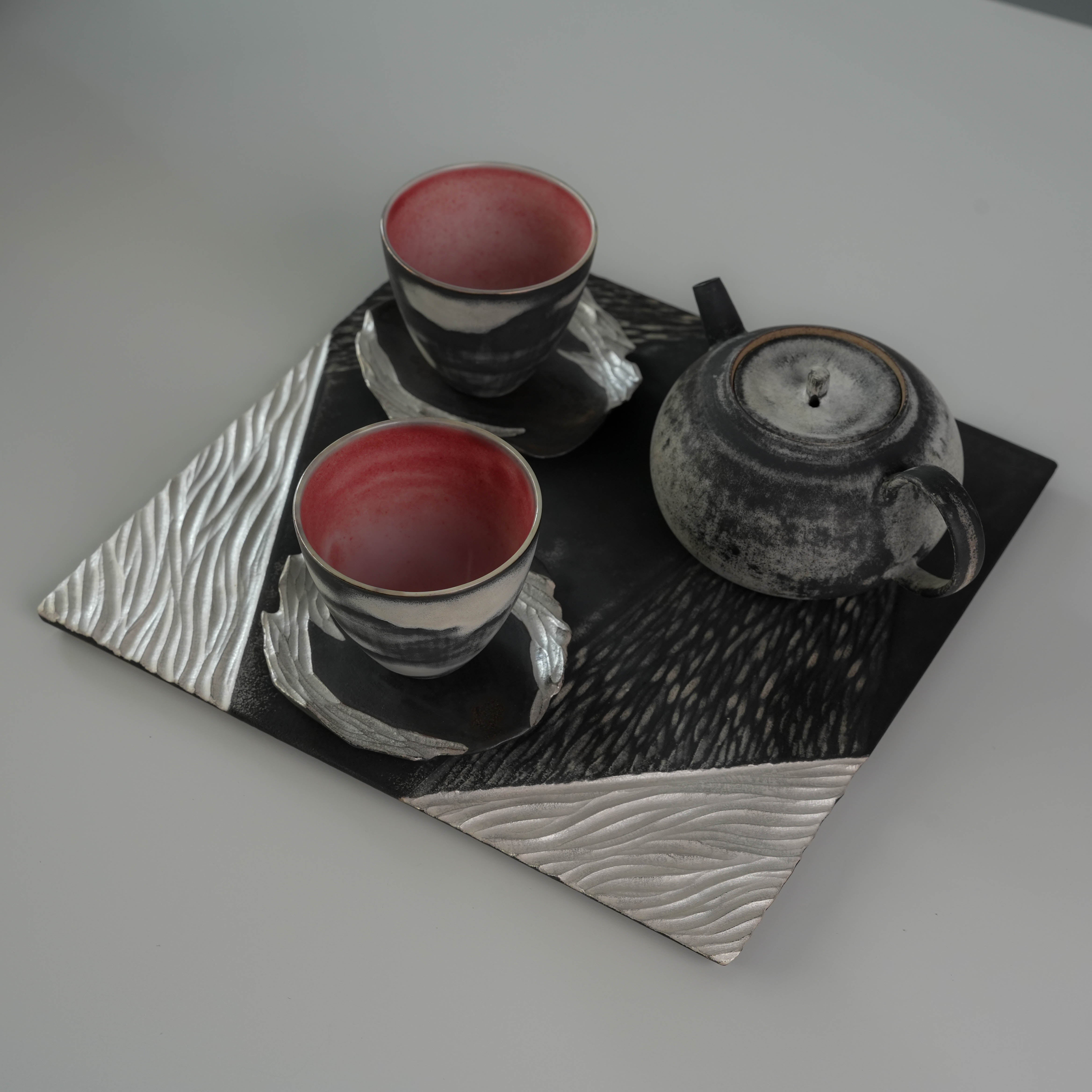 Lonesome Studio Gushan Tea Set - Handmade Silver Glaze | Elegant tea set with two cups, teapot, and textured tray in black and silver tones.
