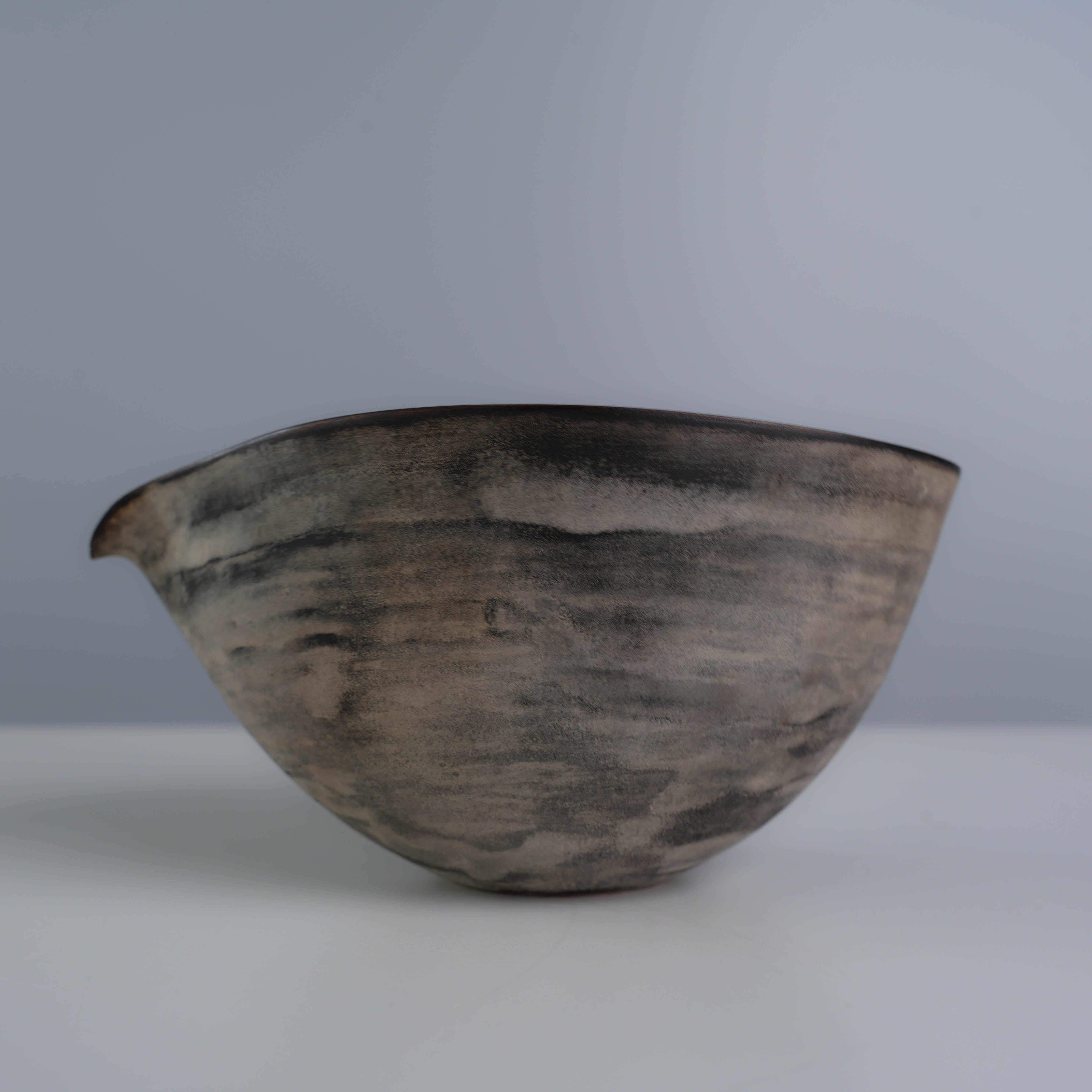 Side view of Lonesome Studio Qushui tea pitcher with black and silver glaze, part of the handmade Gongfu Cha tea set collection.