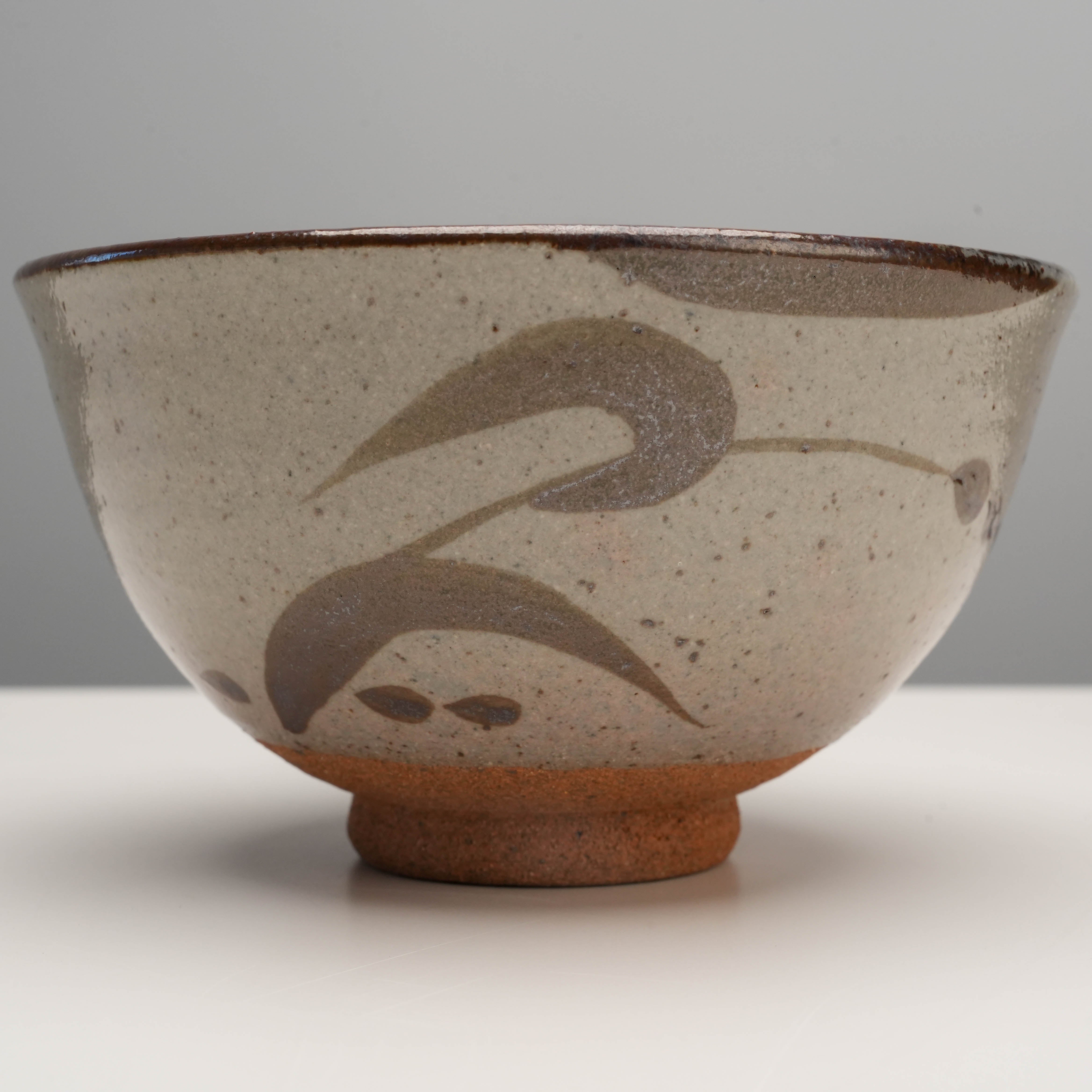Close-up of Arita Ware E-Karatsu Matcha Bowl showcasing unique hand-painted leaf design and textured ceramic finish for artisanal appeal.