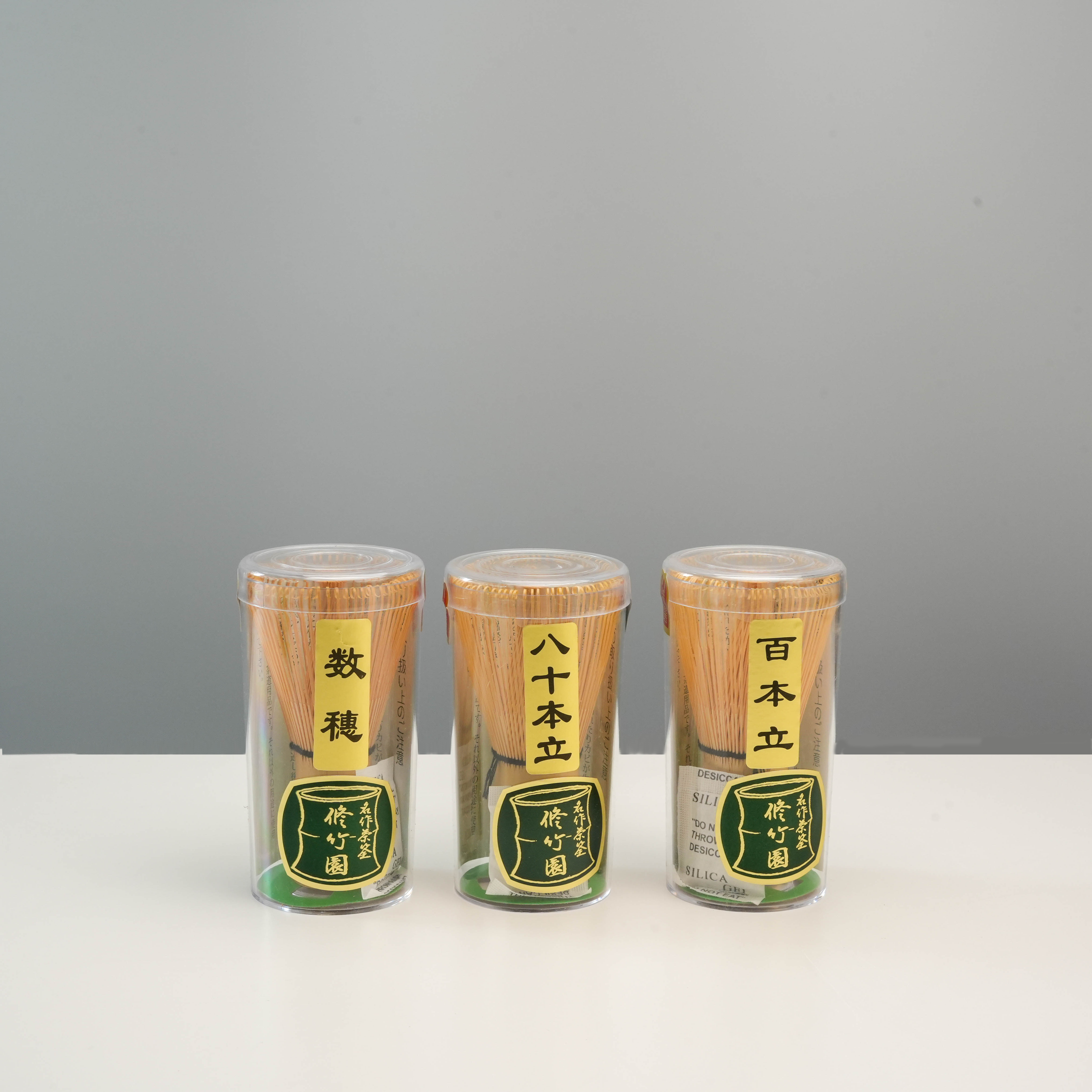 Three Syuchikuen bamboo matcha whisks in varying tine counts, including the 100 Tines model, ideal for Japanese tea enthusiasts and collectors.