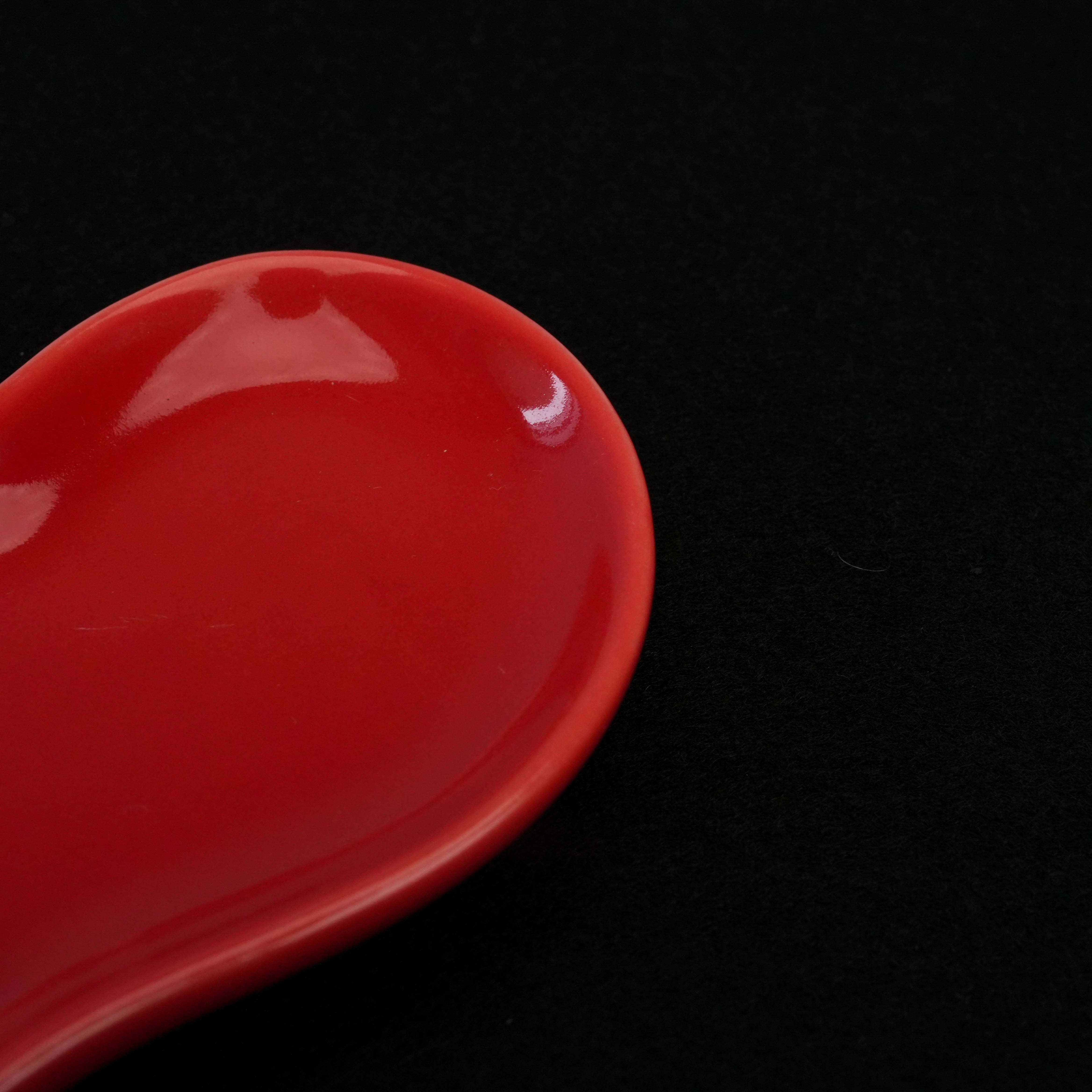 Detail view of the Arita Red Heart Plate highlighting the smooth porcelain surface and elegant curves, suited for stylish home accents.
