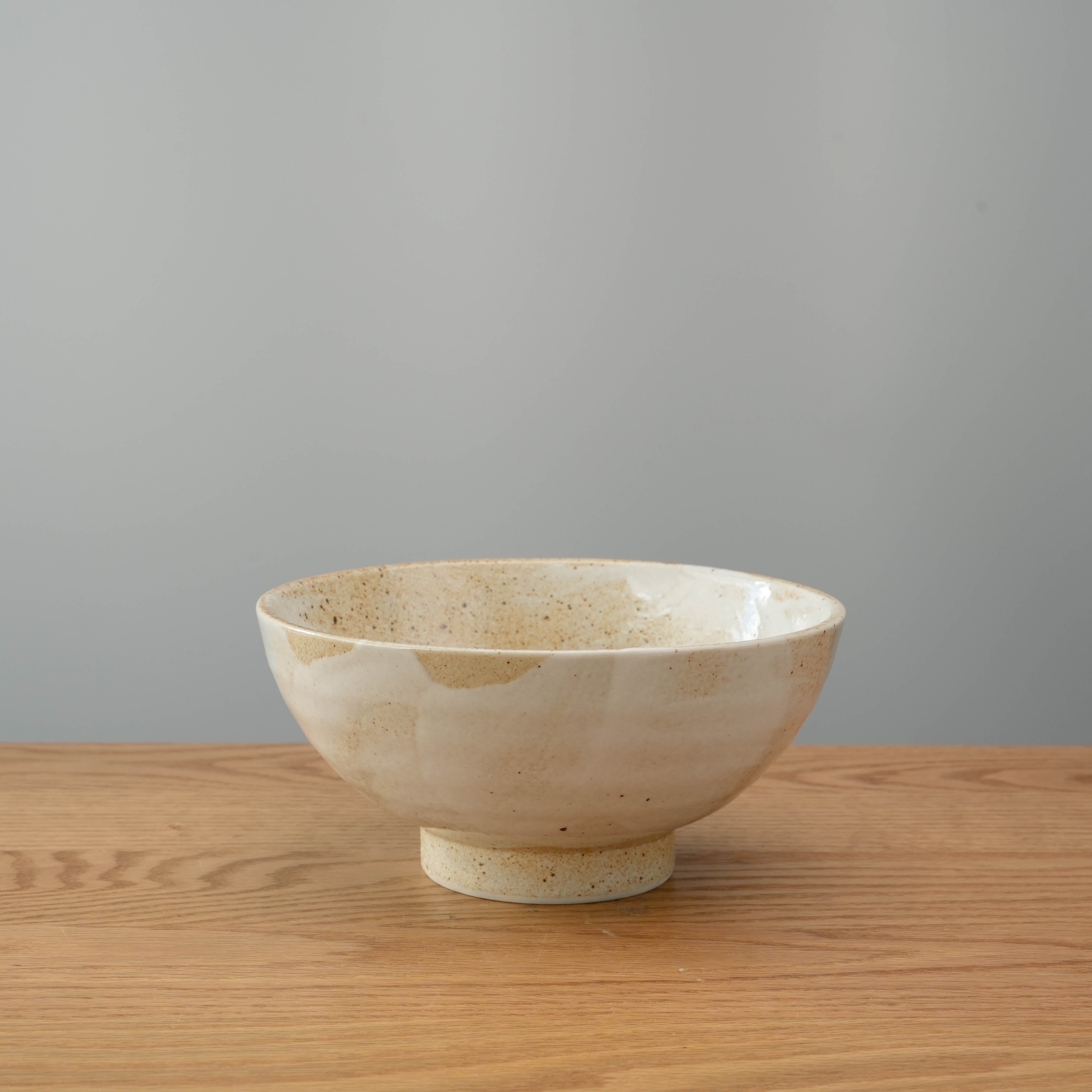 Elegant Mino Ware Donburi Bowl in Wabi Sabi style with footed base. A versatile piece for serving traditional Japanese meals.
