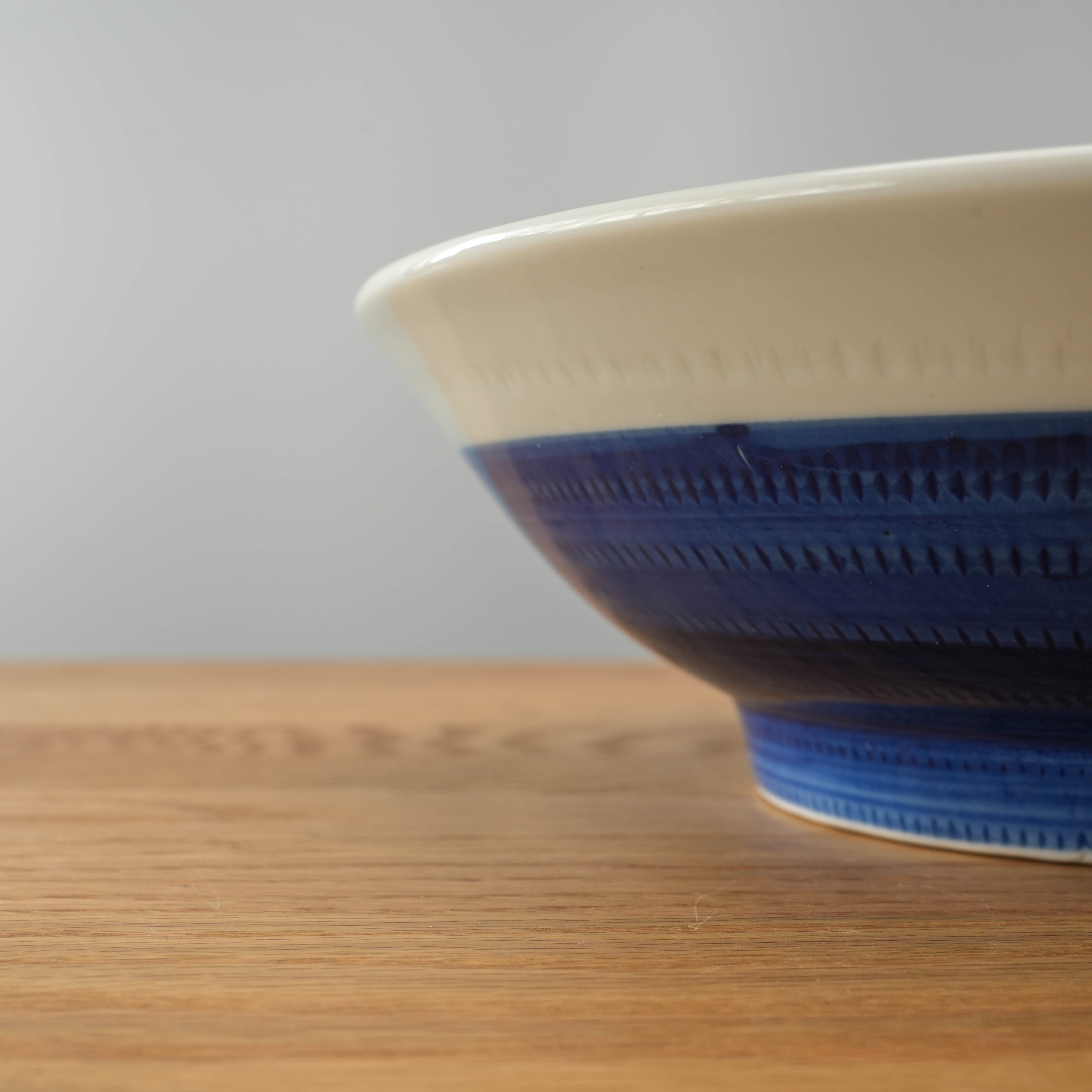 Side view of Mino Ware Tochiri Donburi Bowl showcasing deep blue brush pattern and flared rim, perfect for hearty meals or noodles.