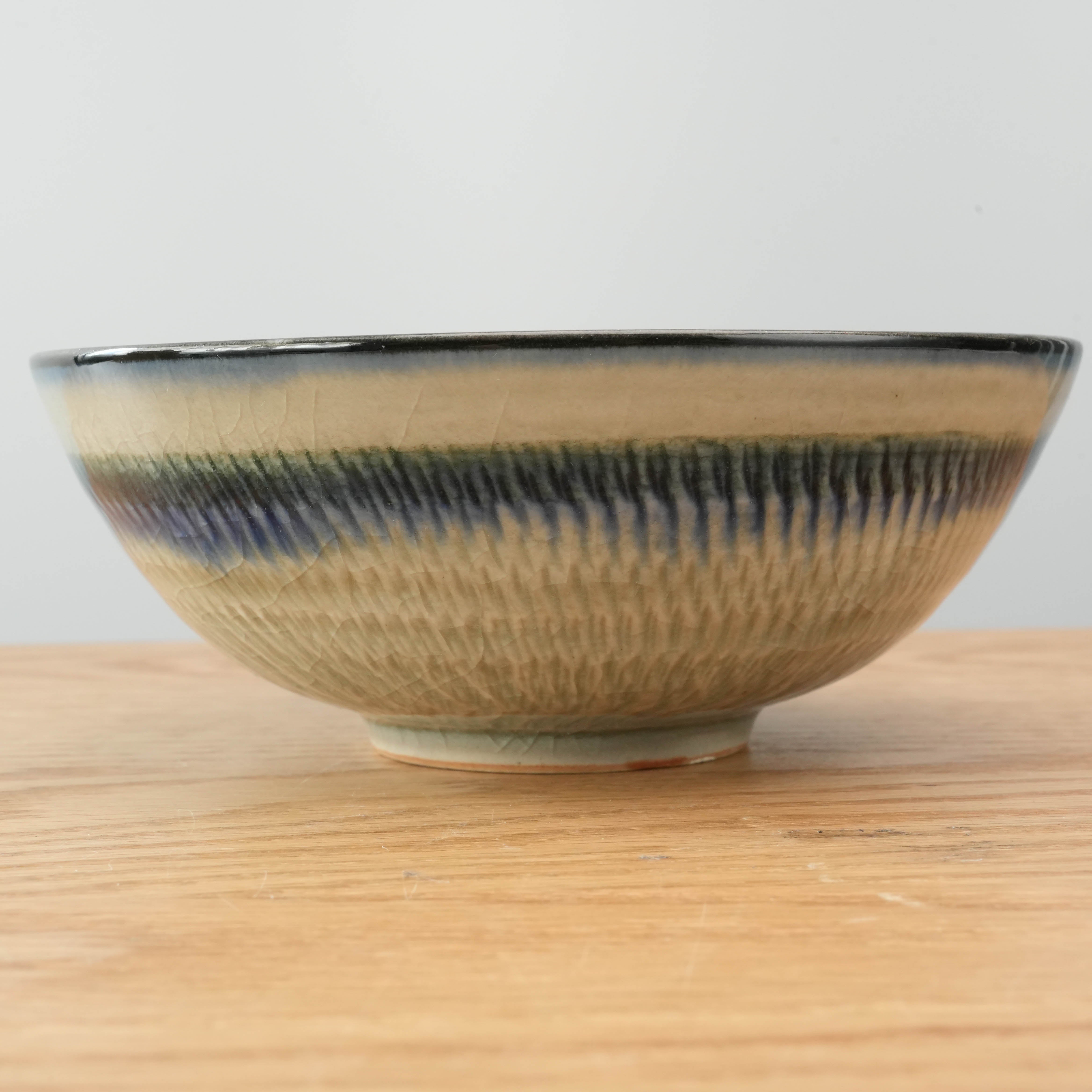 Side view of handcrafted Mino Ware Bowl with traditional Ofuke-glaze, highlighting its artisanal texture and gradient blue-green finish.