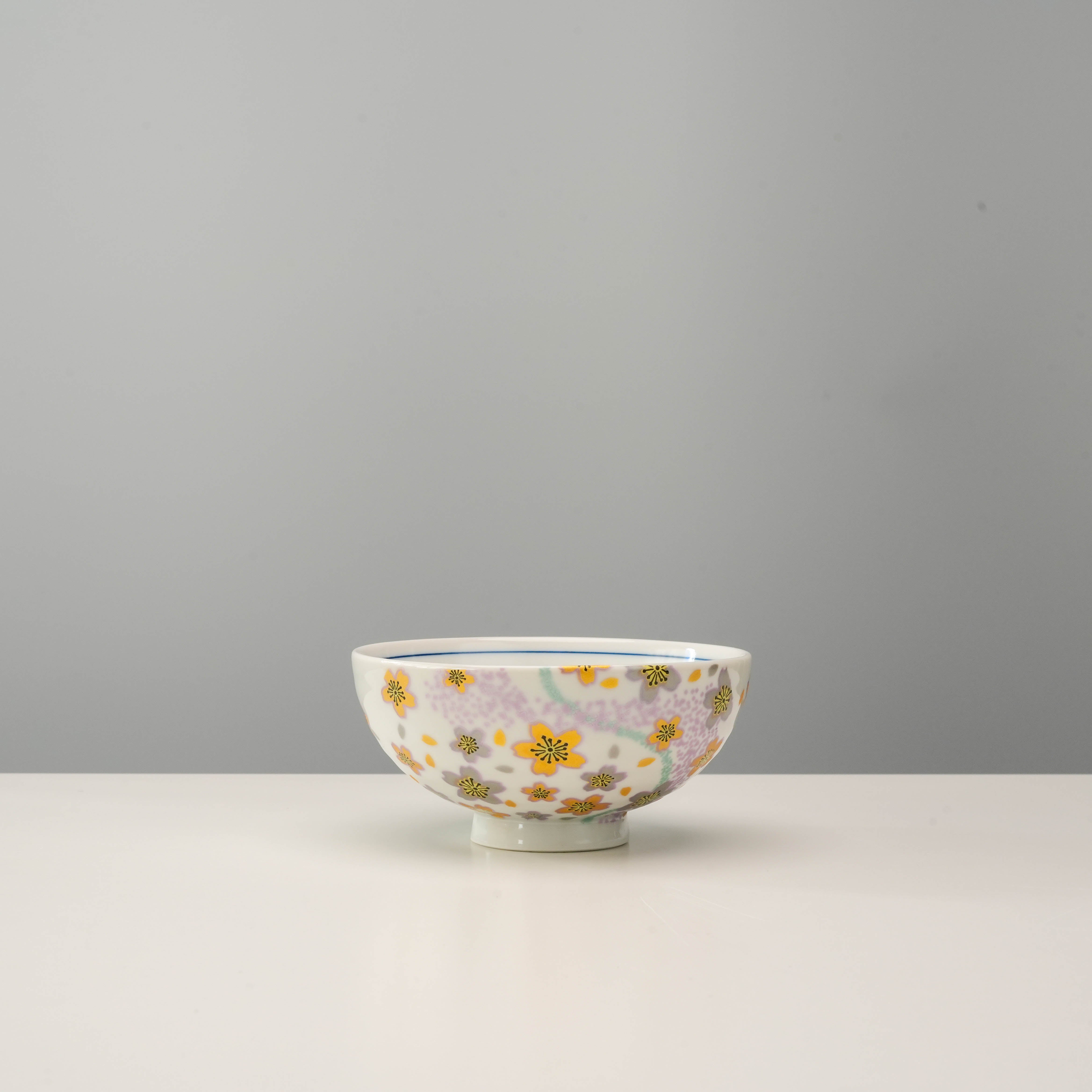 Kutani Ware rice bowl from Kyokusui Flower Set with purple and yellow floral accents, ideal for stylish kitchen and dining collections.