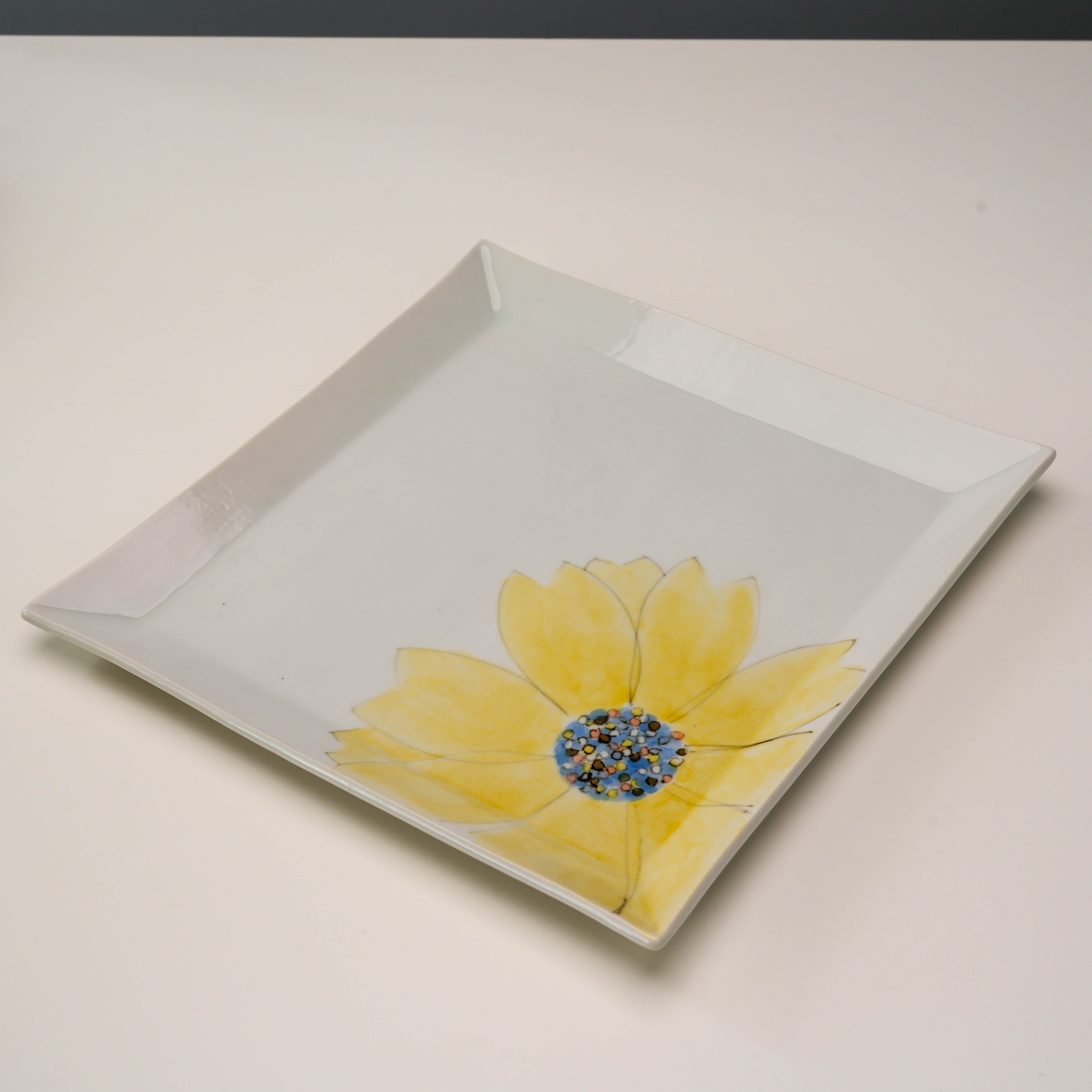 Angled view of the square Kutani Ware Yellow Petal Serving Plate, perfect for stylish food presentation or decorative use.