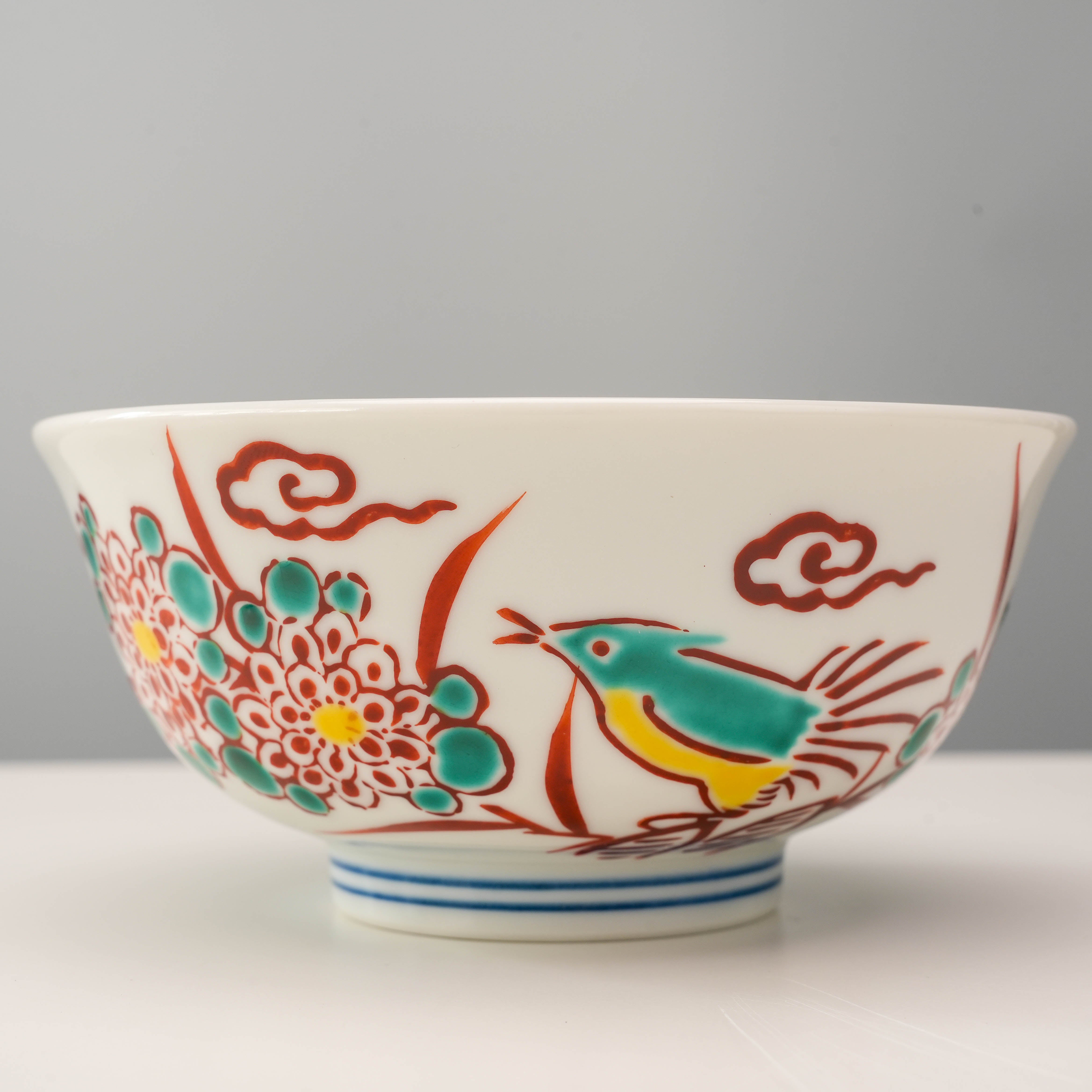 Close-up of Kutani Ware Rice Bowl showing intricate red bird and chrysanthemum artwork, crafted for traditional table settings.