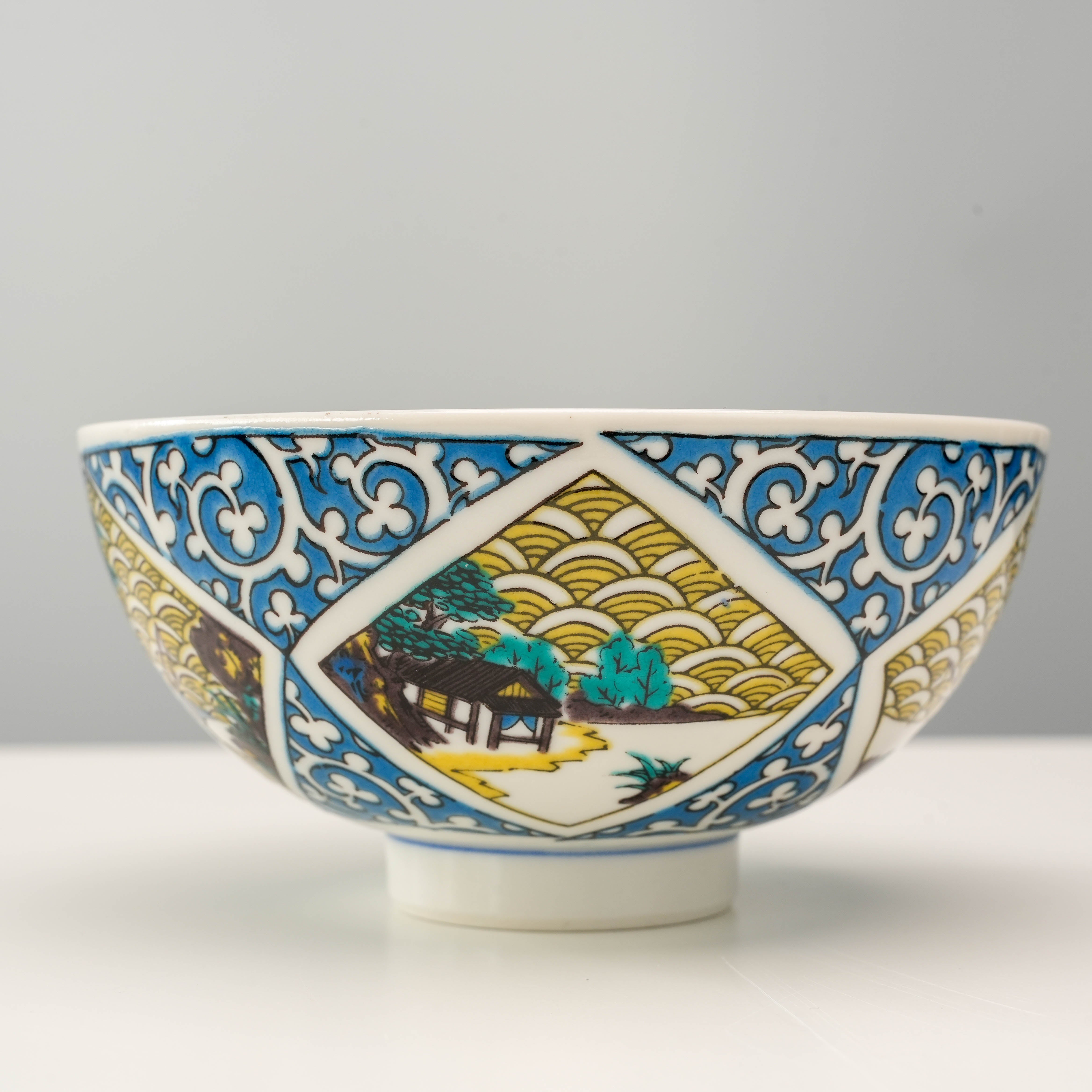 Kutani Ware Rice Bowl - Arabesque & Landscape design with traditional Japanese scenery and ornate detailing, perfect for stylish table settings.