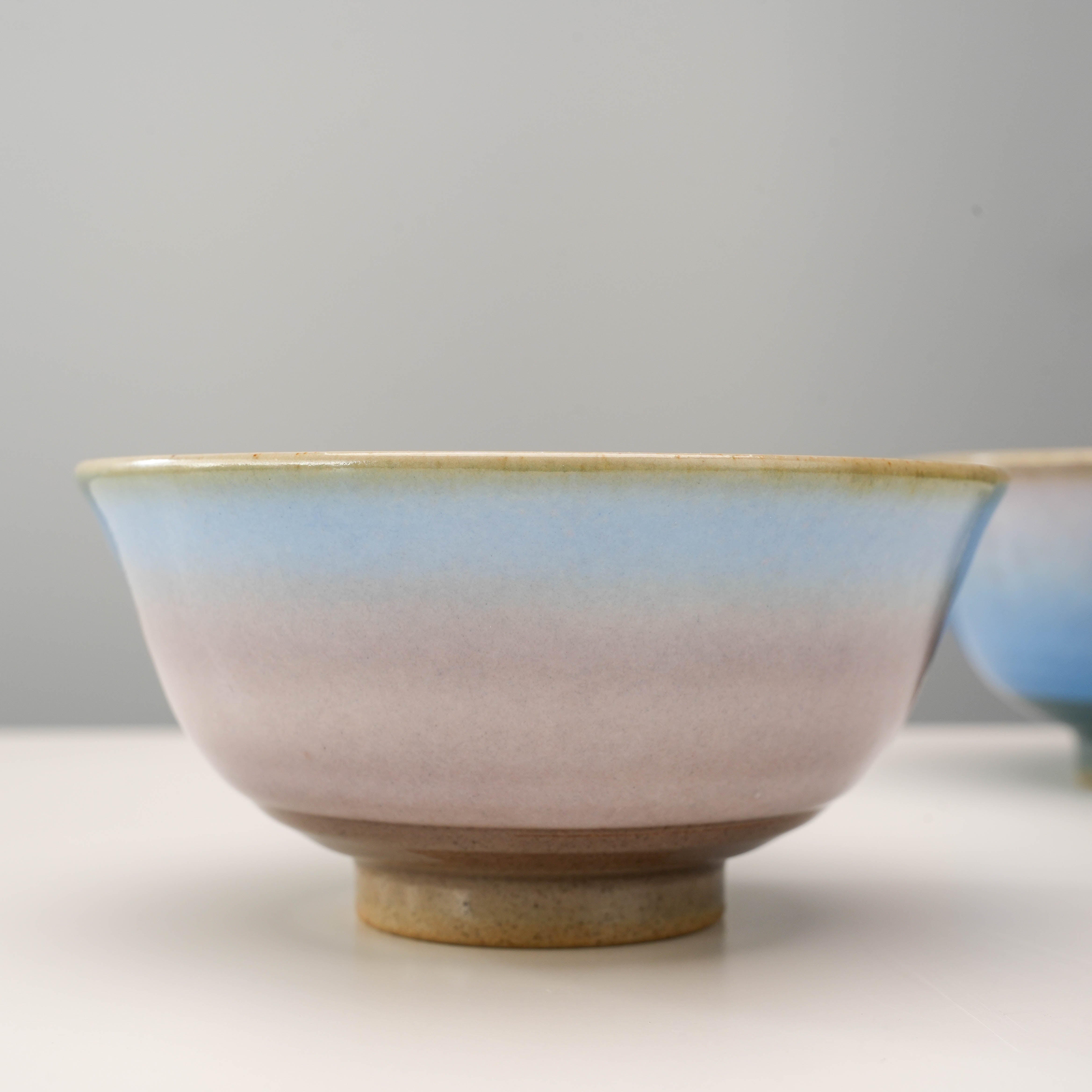 Close-up of pink Kutani Ware Rice Bowl with Yusai Glaze, showing the soft pastel gradient and fine ceramic craftsmanship.