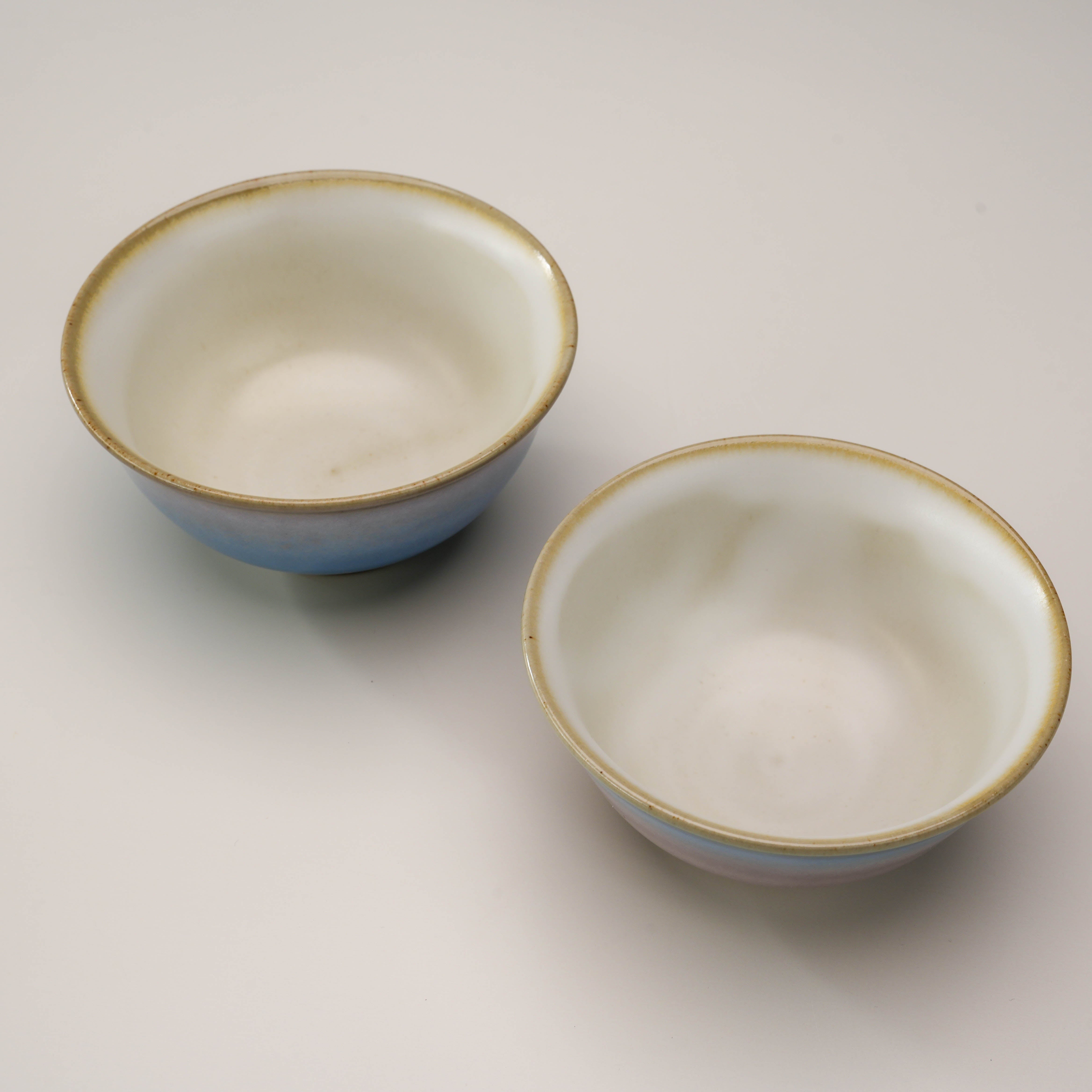 Top view of Kutani Ware Rice Bowls - Yusai Glaze Set, displaying the smooth white interiors and elegant rim detailing.