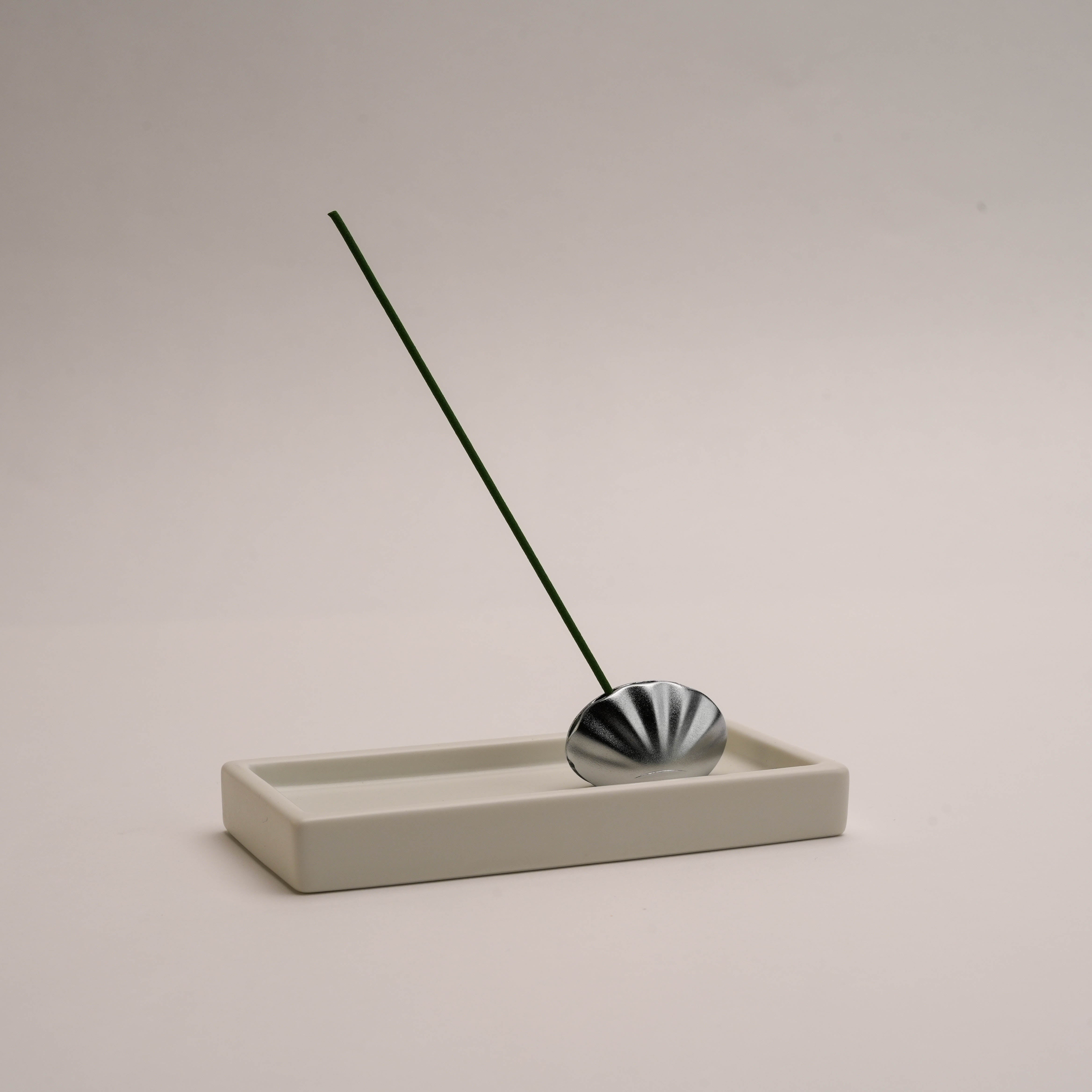 Shoyeido Kolip Shell incense holder and tray set in white, showcasing a sleek, modern design ideal for meditation and home decor.