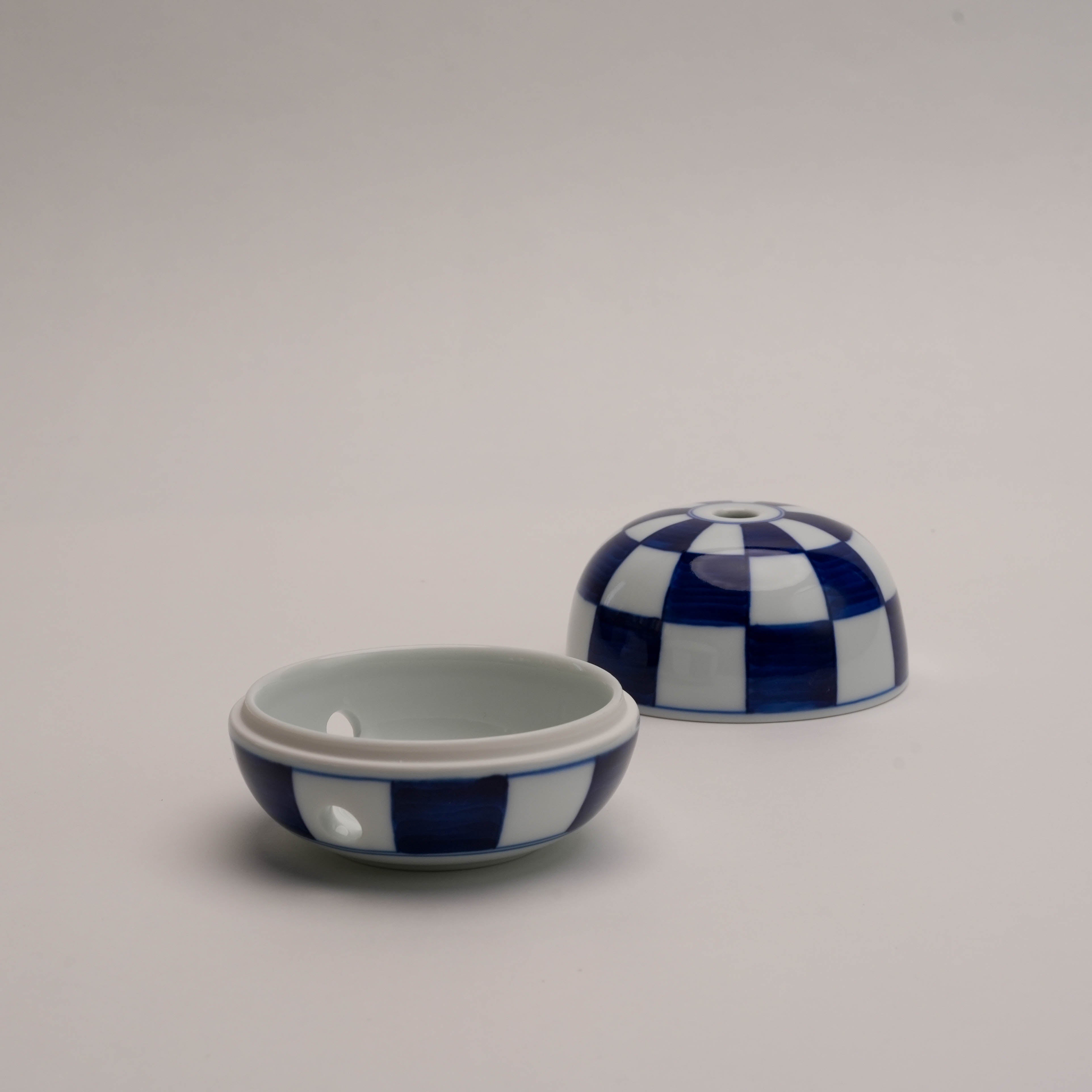 Disassembled Miyuki Stone Incense Burner by Shoyeido, showcasing its versatile two-piece ceramic construction for easy incense use.