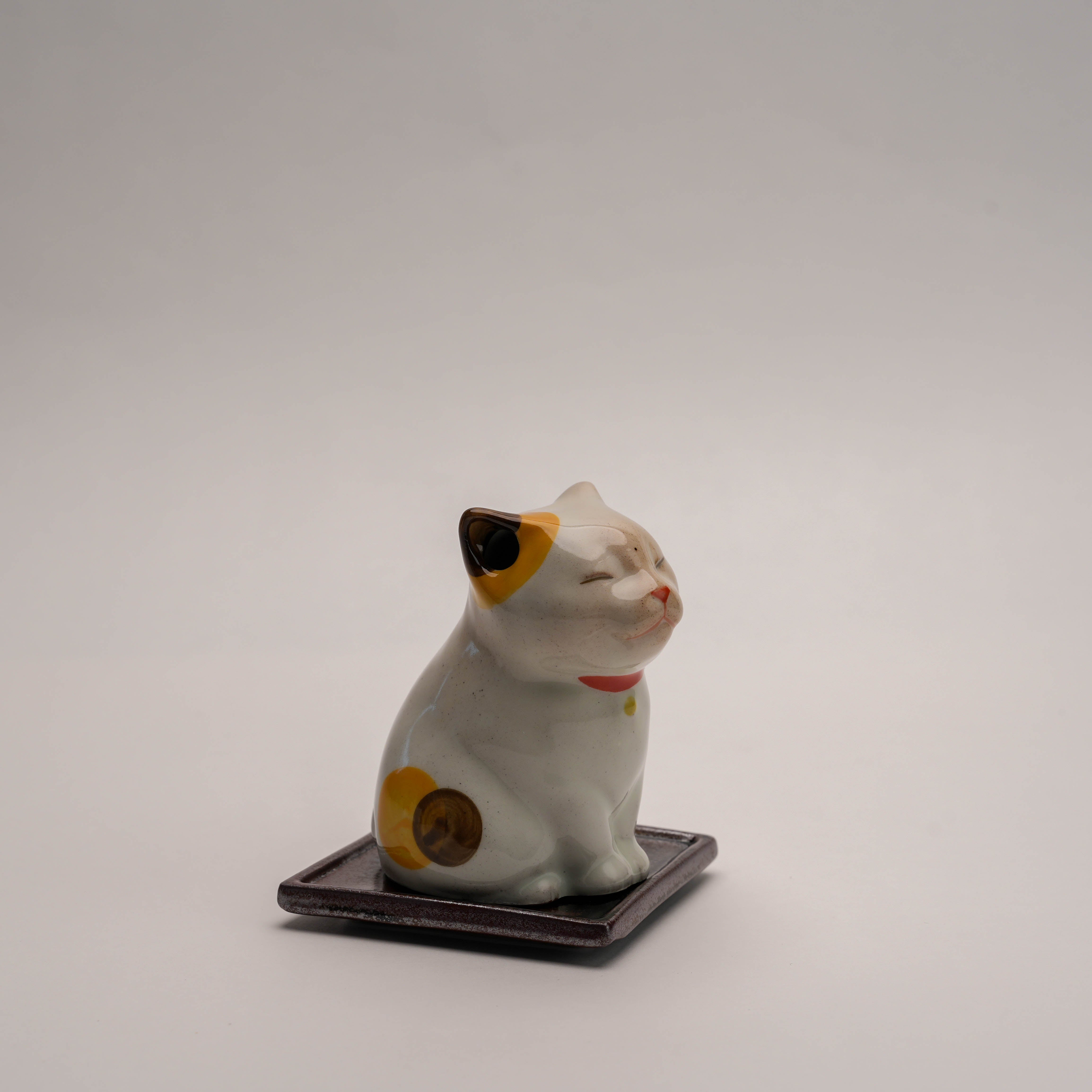 Angled view of Shoyeido Cat Incense Burner highlighting its detailed design and dual incense compatibility for home fragrance use.