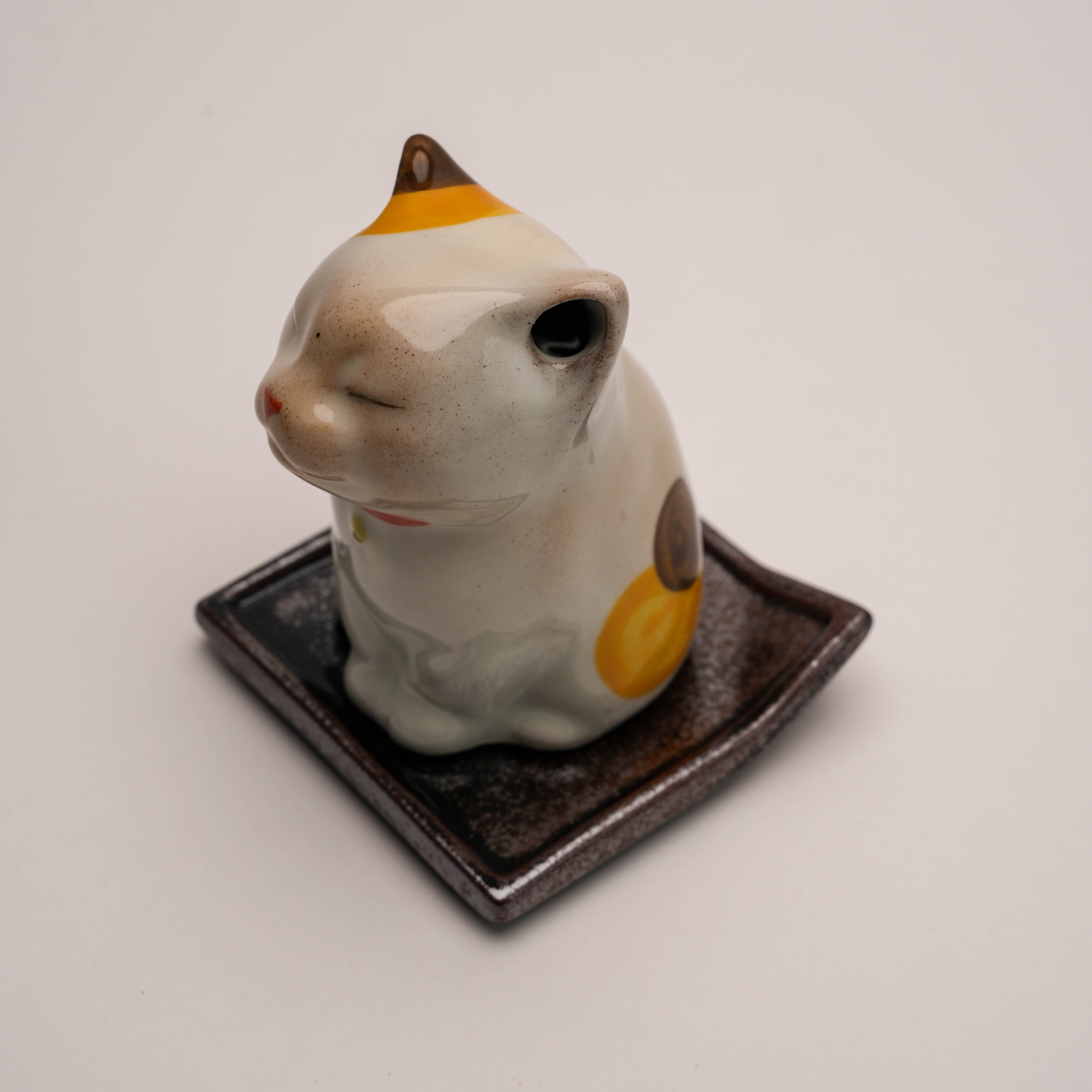 Top view of Shoyeido Cat Incense Burner showing ceramic cat lid and tray, blending charm and function for incense lovers.