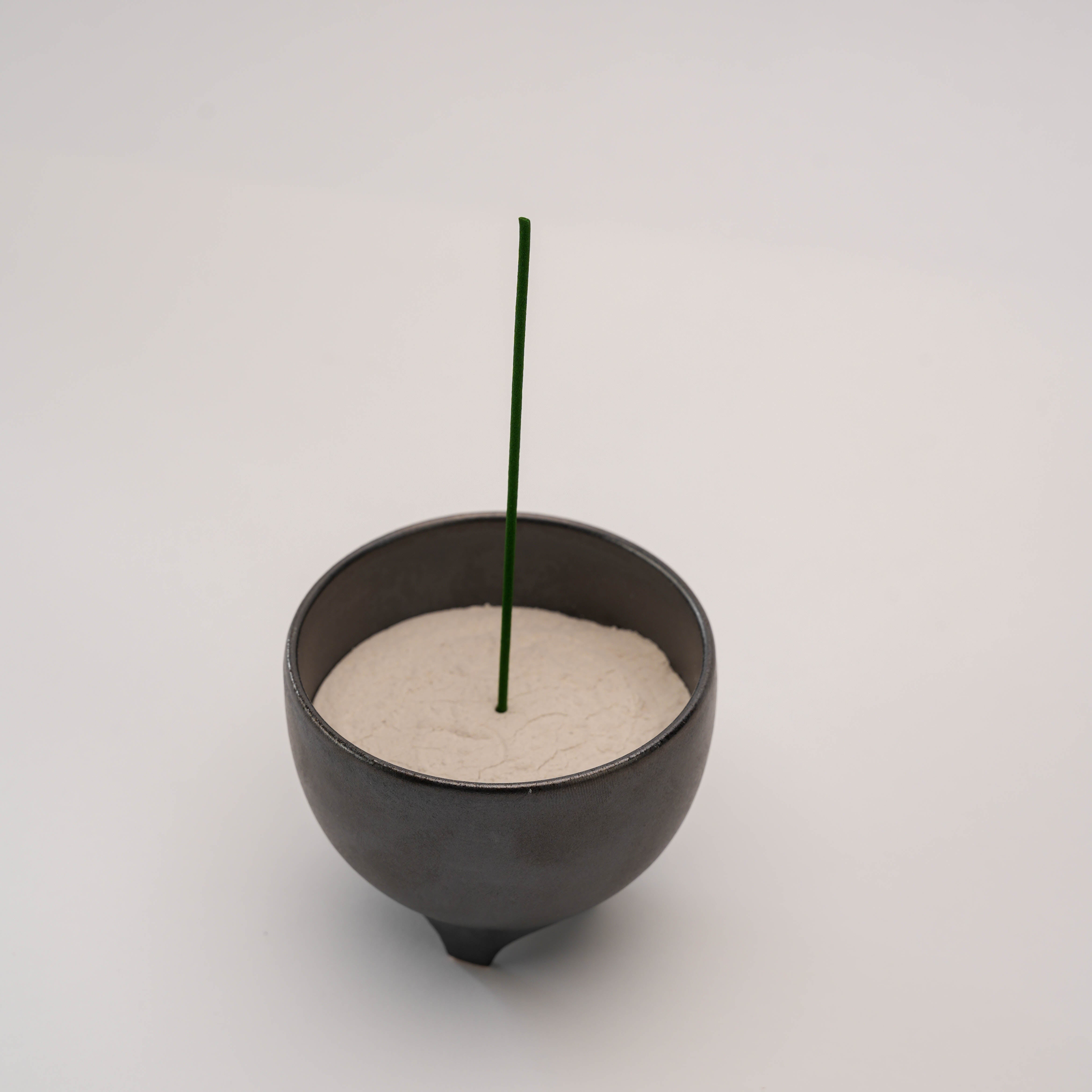 Shoyeido Incense Censer - Sumi with incense stick inserted in white ash, perfect for elegant and functional incense burning.