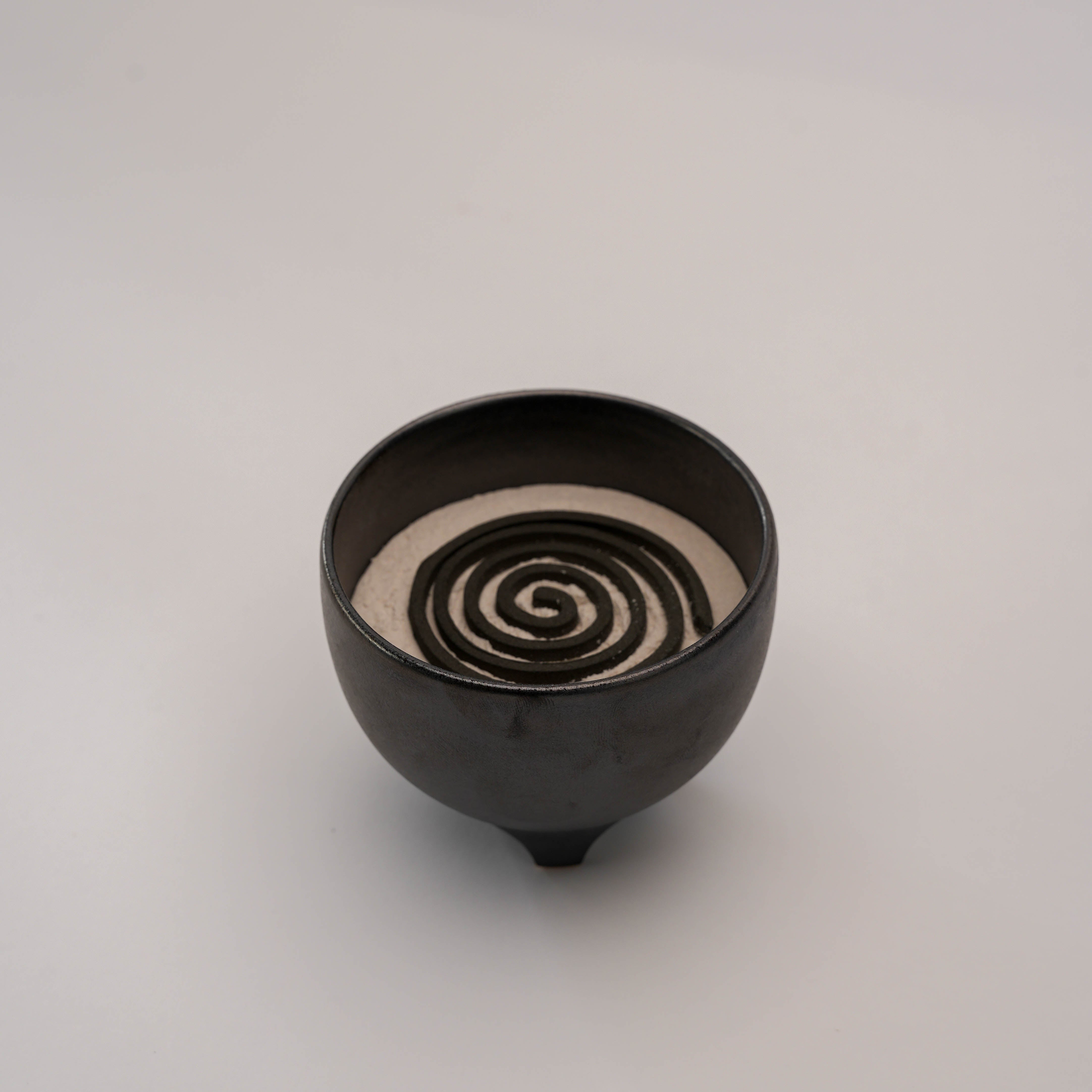Shoyeido Incense Censer - Sumi displaying a spiral incense coil on white ash, combining traditional Japanese design with modern decor.