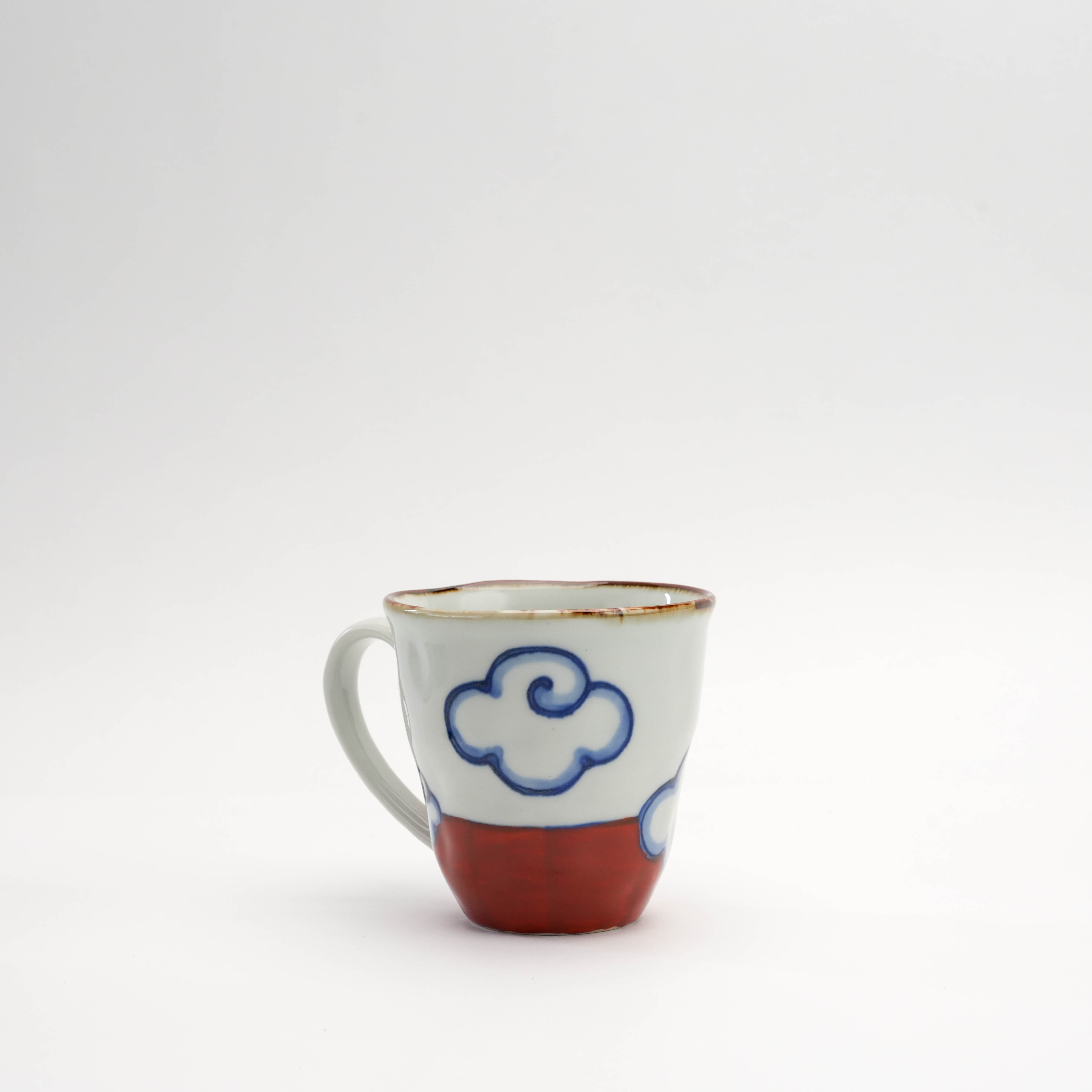 Back view of red Arita Ware Mt Fuji Mug showing hand-painted cloud detail. Unique Japanese craftsmanship in ceramic drinkware.