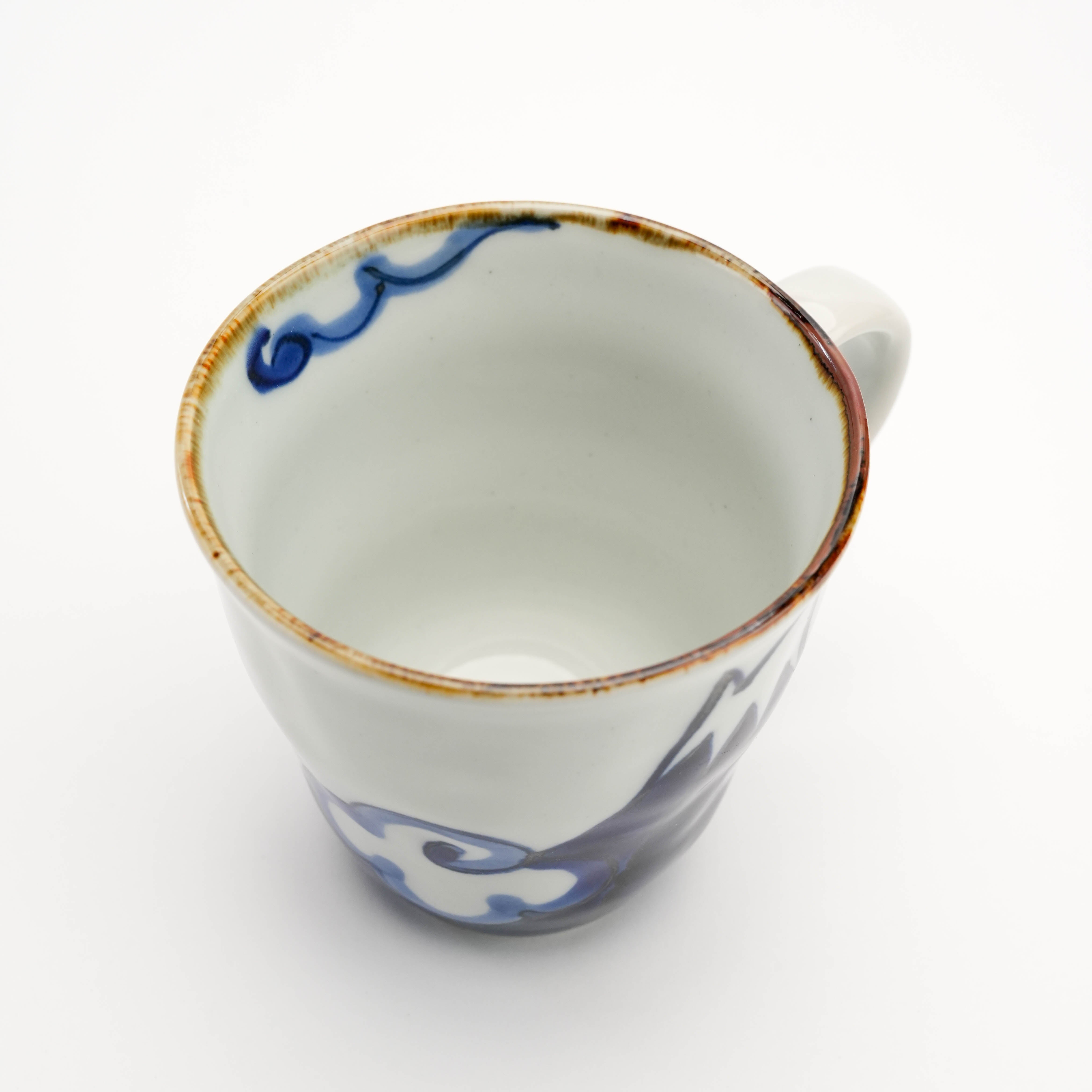 Top view of blue Arita Ware Mt Fuji Mug with visible interior and rim design. Hand-painted Japanese drinkware for home and garden.