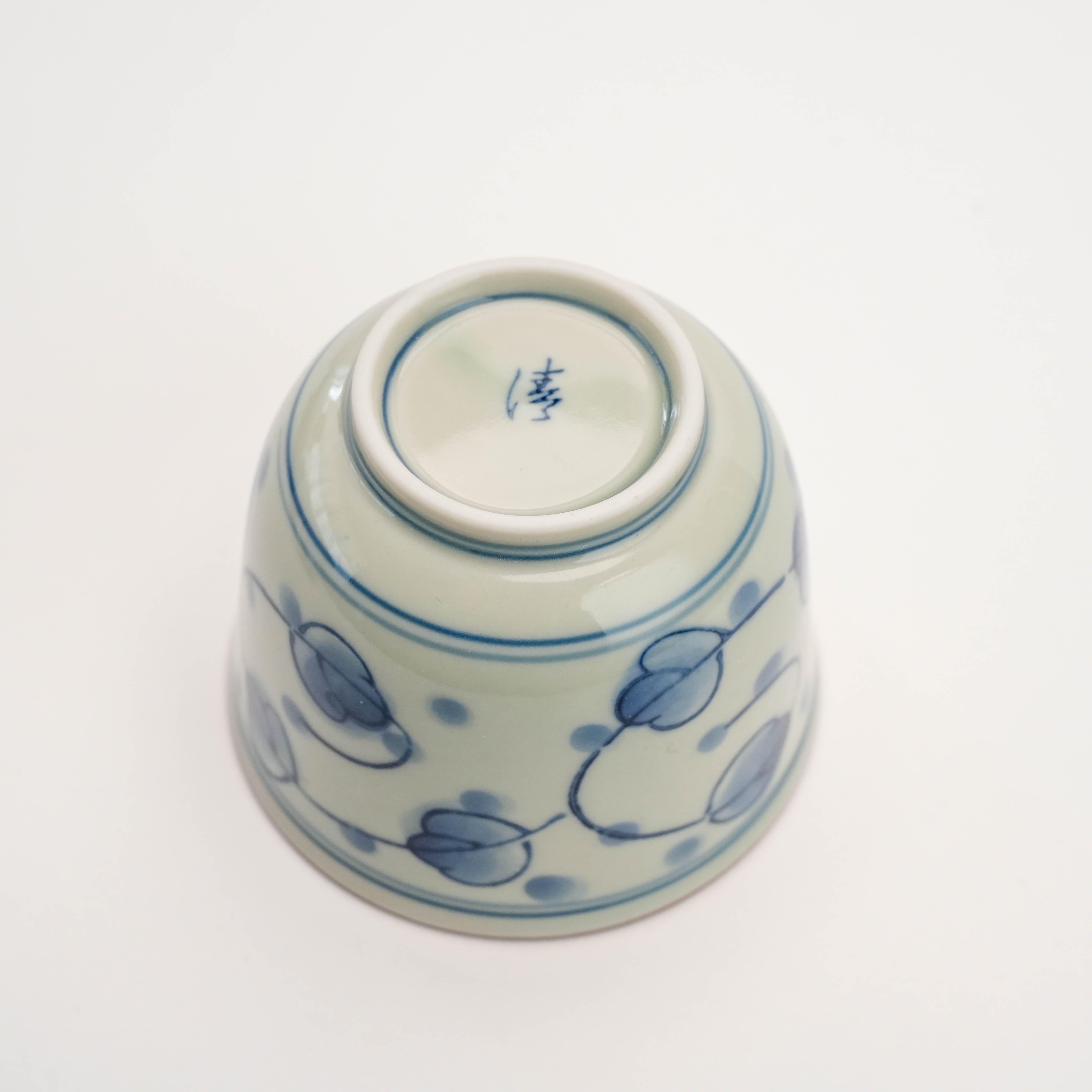 Bottom view of Arita Ware Miyakogusa Tea Cup featuring hand-painted blue design and maker's mark, collectible ceramic decor.