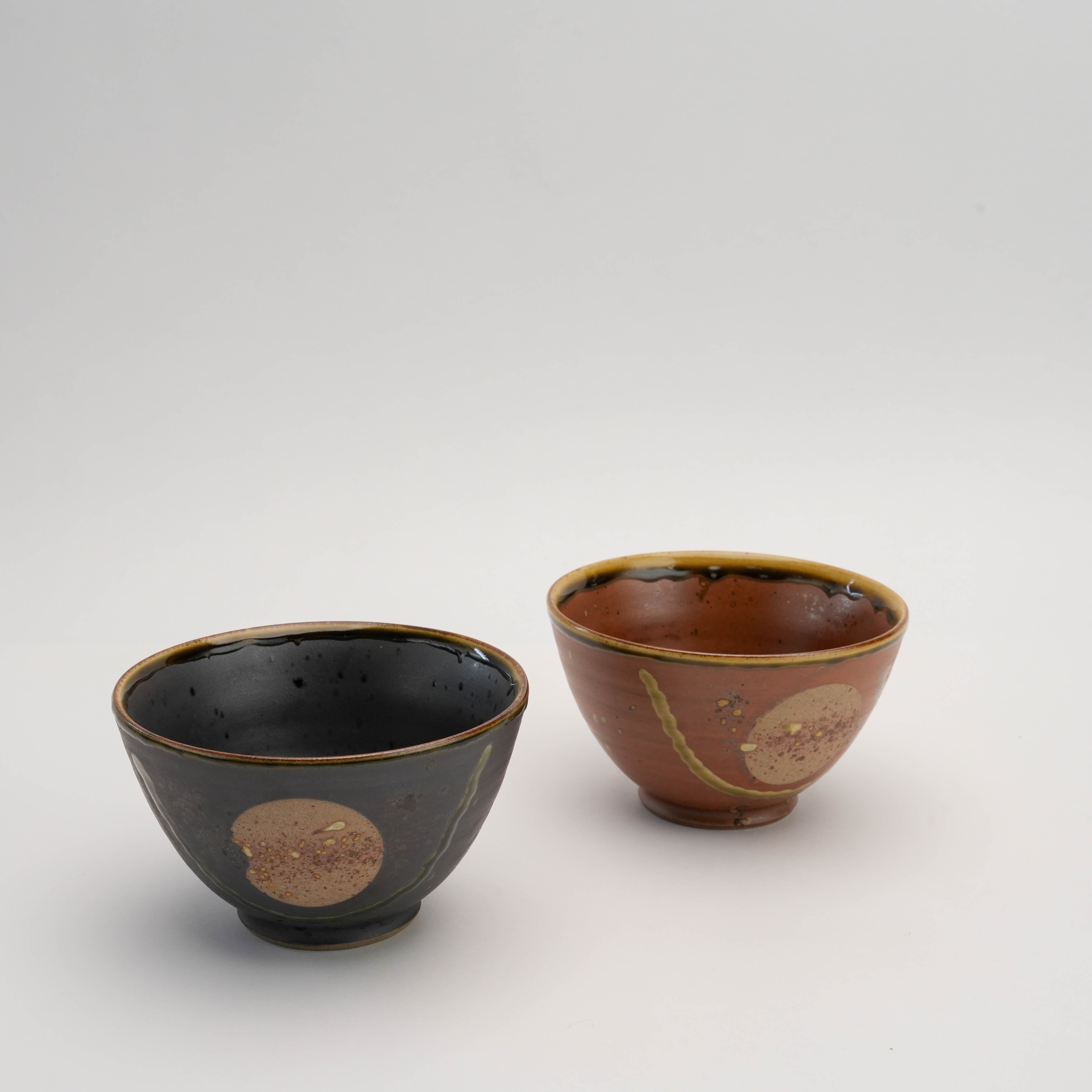 Arita Ware Fukukasu rice bowls in brown and black variants, perfect for Japanese-inspired dining and mindful tea rituals.