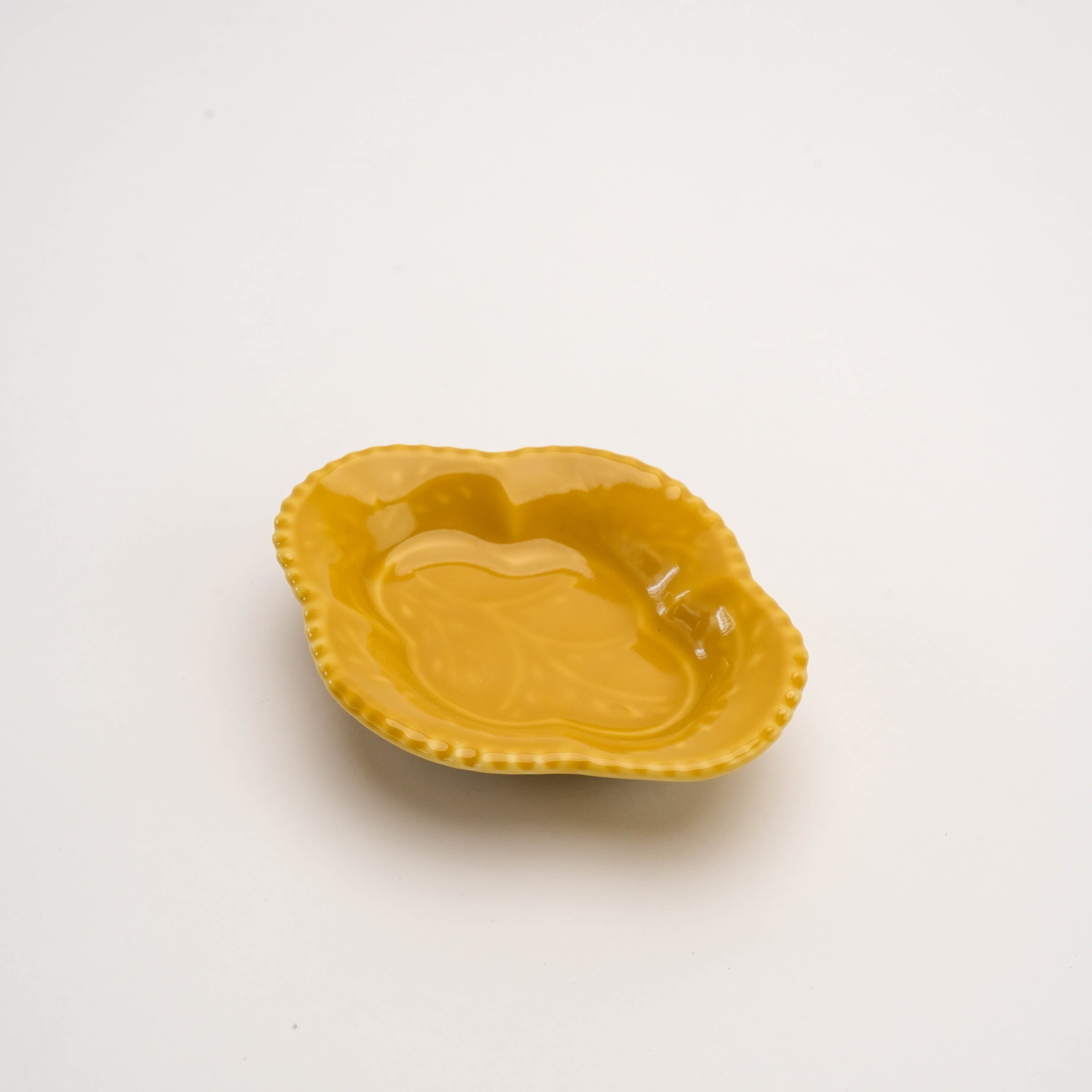 Yellow Arita Ware Quince Dish with glossy finish and embossed leaf motif. A vibrant accent for condiment presentation in home decor.