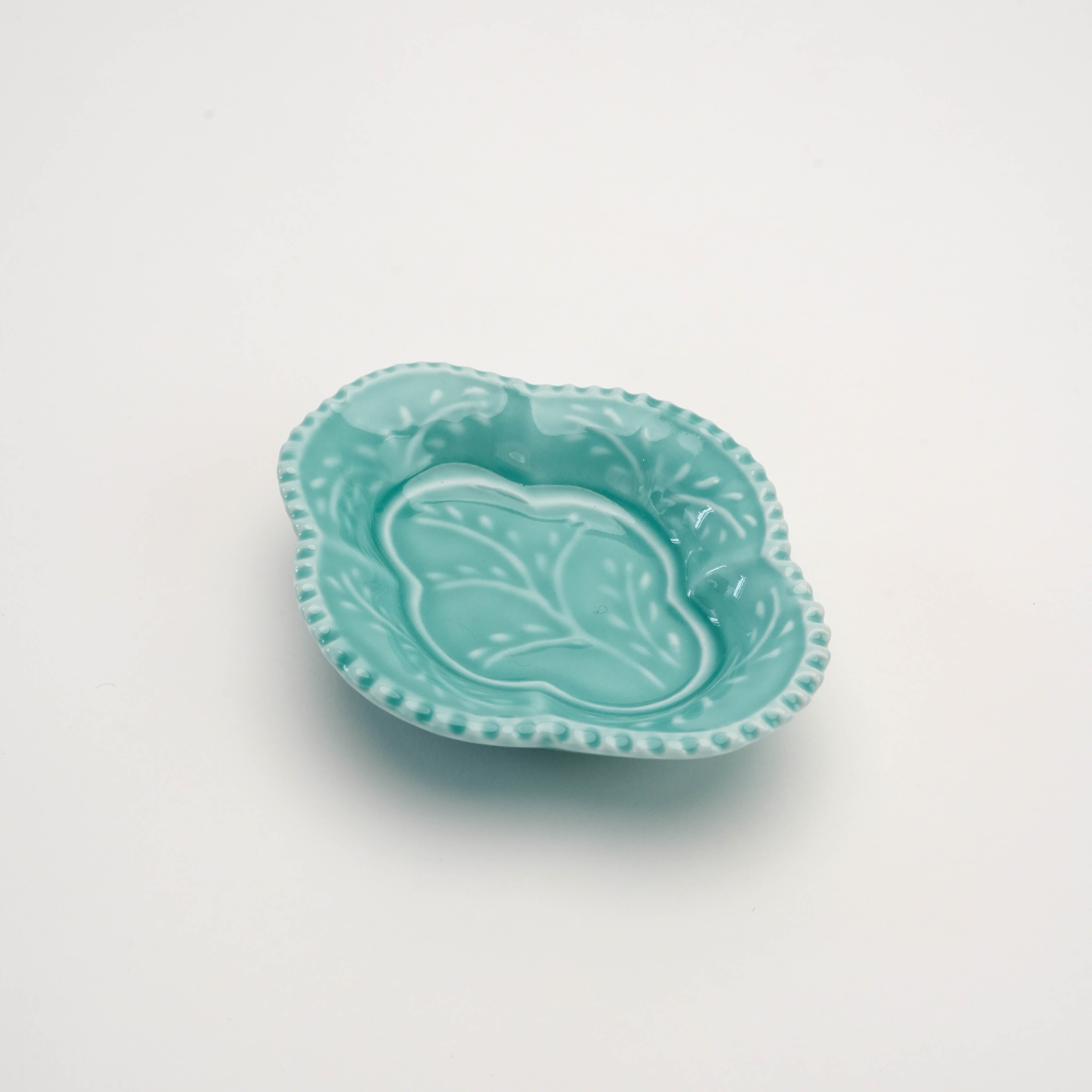 Celadon Arita Ware Quince Dish featuring embossed leaf pattern and scalloped edges. Ideal for serving condiments with refined Japanese style.