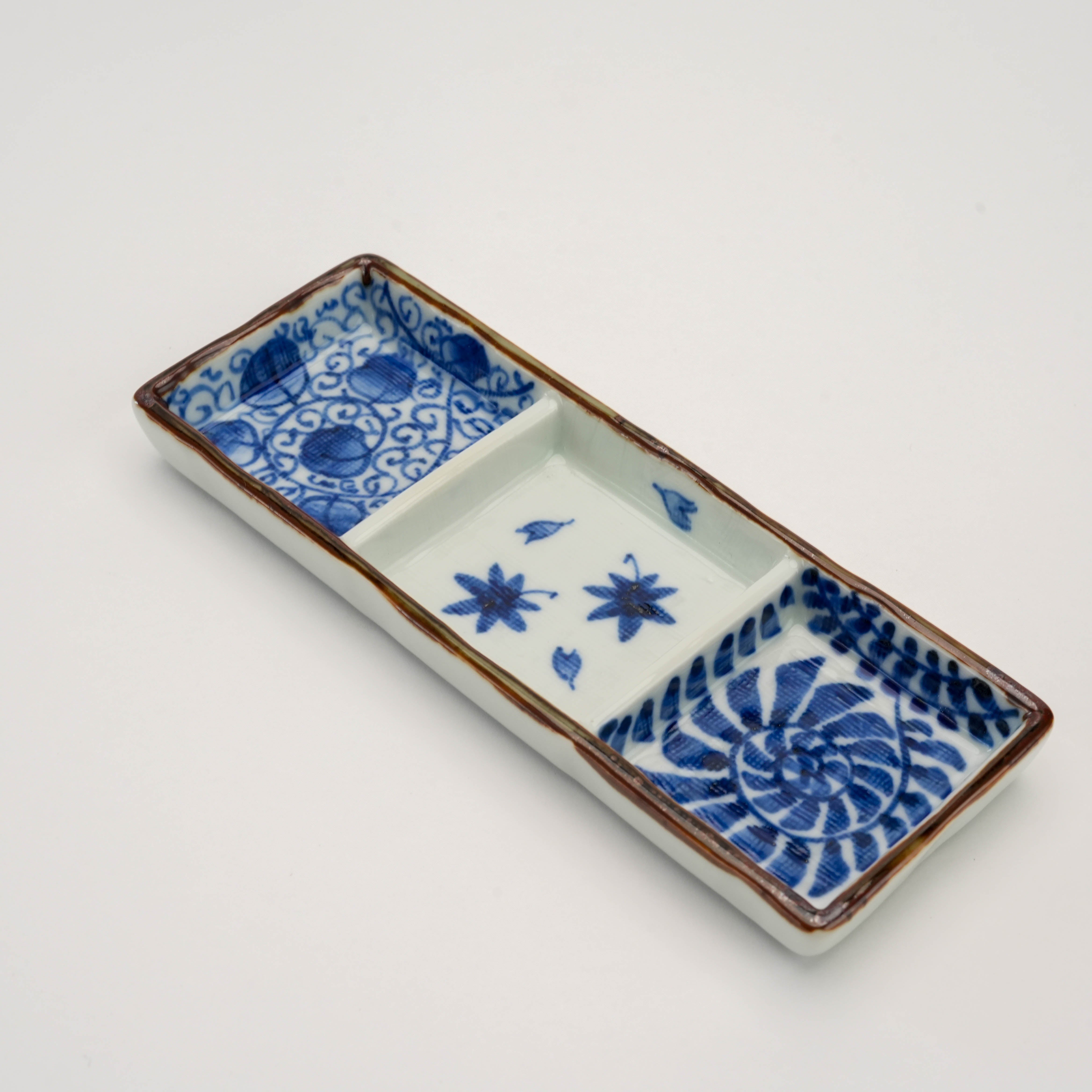 Angled view of Arita Ware Triple Pattern Dish - Triple Dish | Kosome Indigo, highlighting its elegant three-compartment design for stylish serving.