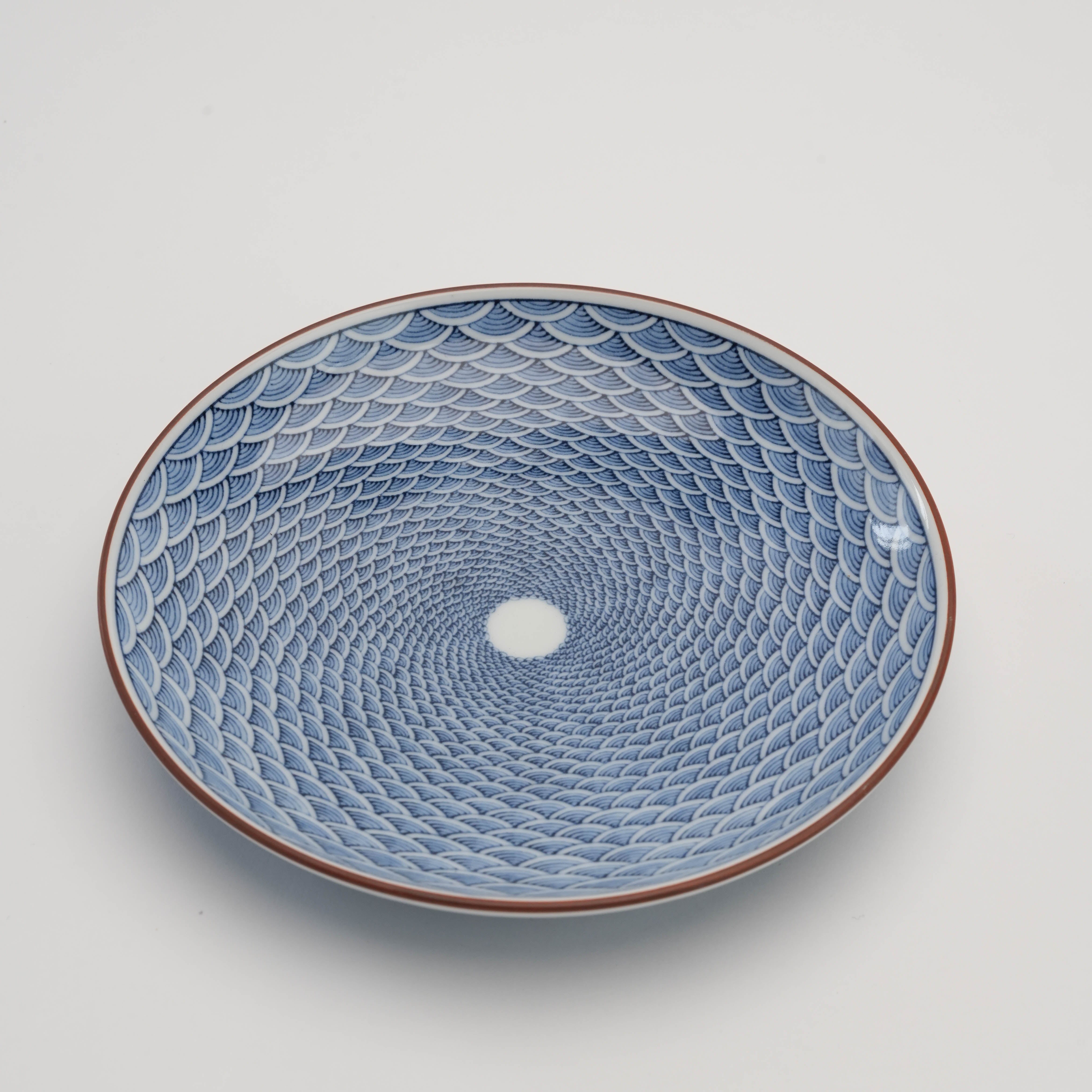 Top angle of Arita Ware Seigaiha Plate - Small Wave Design with concentric blue wave patterns, perfect for serving sweets or as a decorative piece.