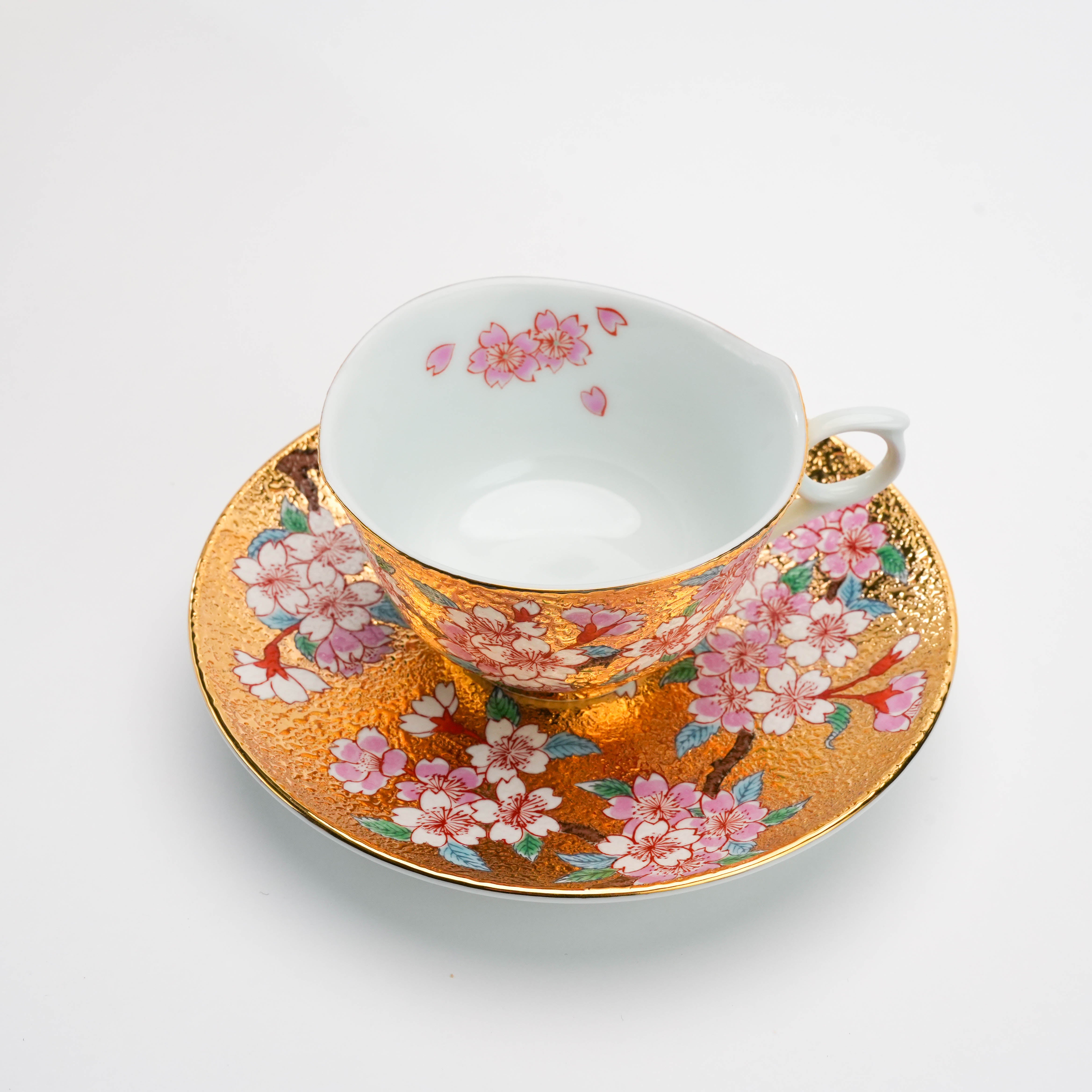 Top view of the Arita Ware Gold Sakura Cup & Saucer. Japanese tea set with delicate cherry blossom design and luxurious gold detailing.