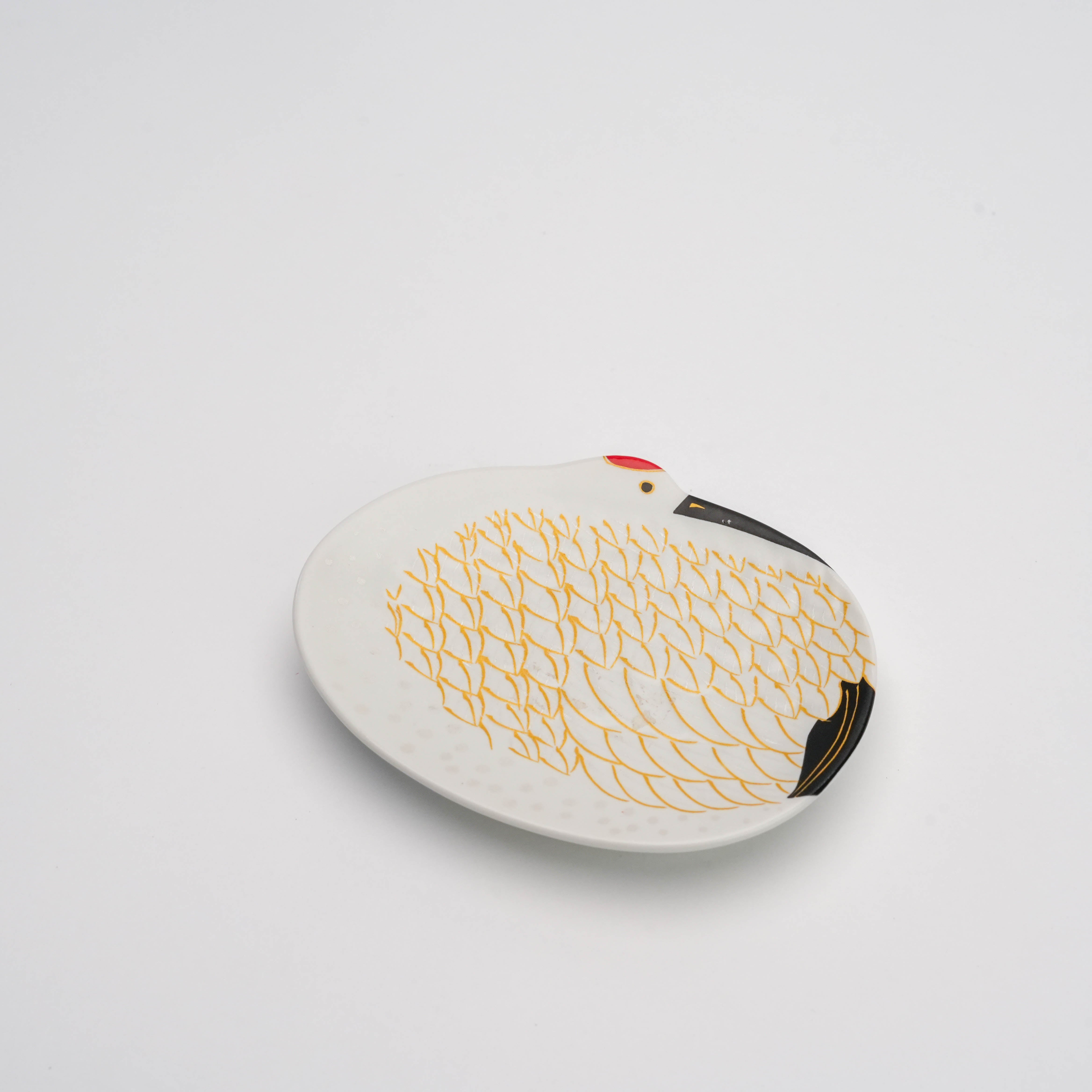 Top angle of Arita Snow-Covered Crane Dish - Small Gold Feather highlights intricate gold feather pattern and crane motif. A graceful serveware piece symbolizing good fortune.