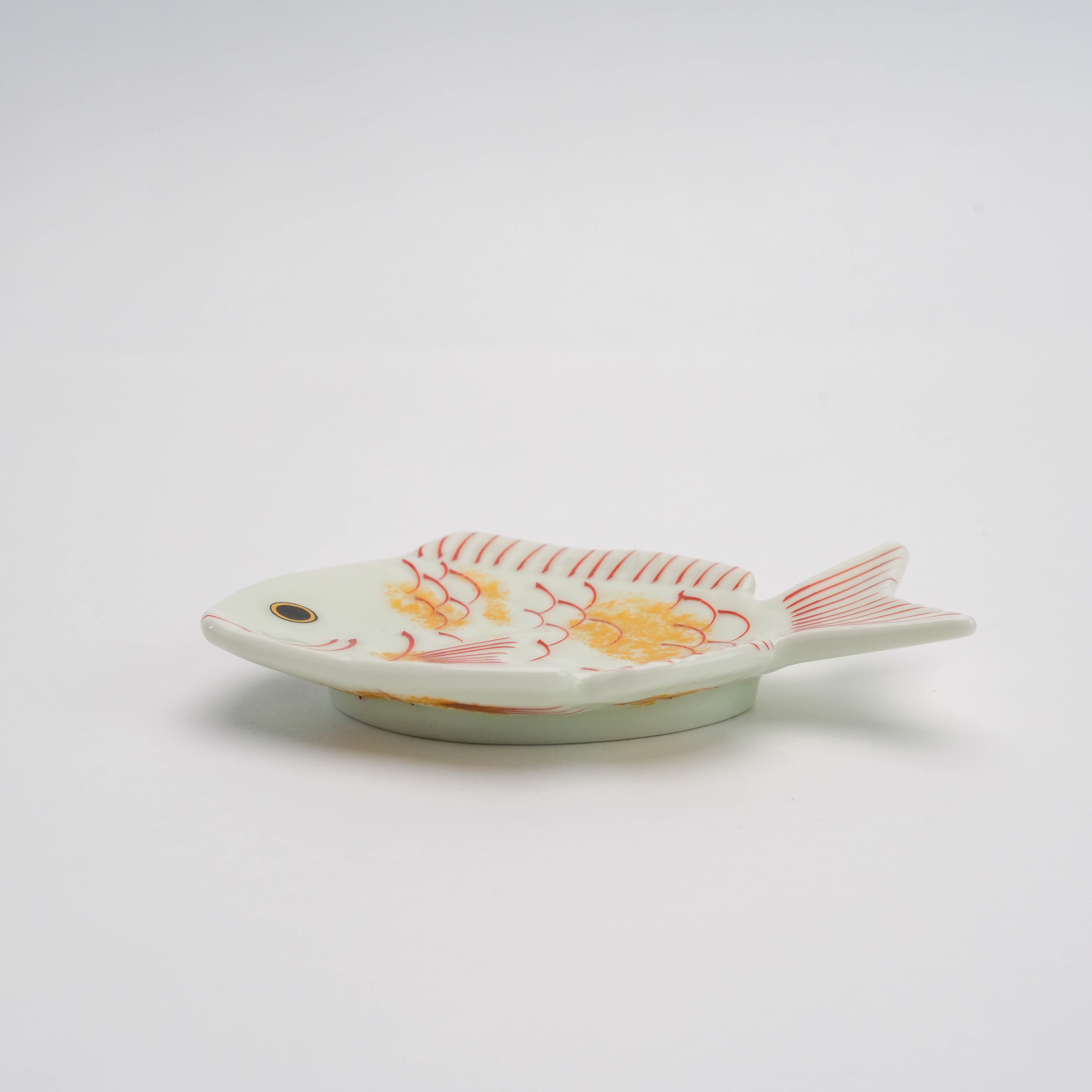 Side view of Arita Ware Small Dish in bream shape with gold accents, showcasing its elegant depth and festive craftsmanship.