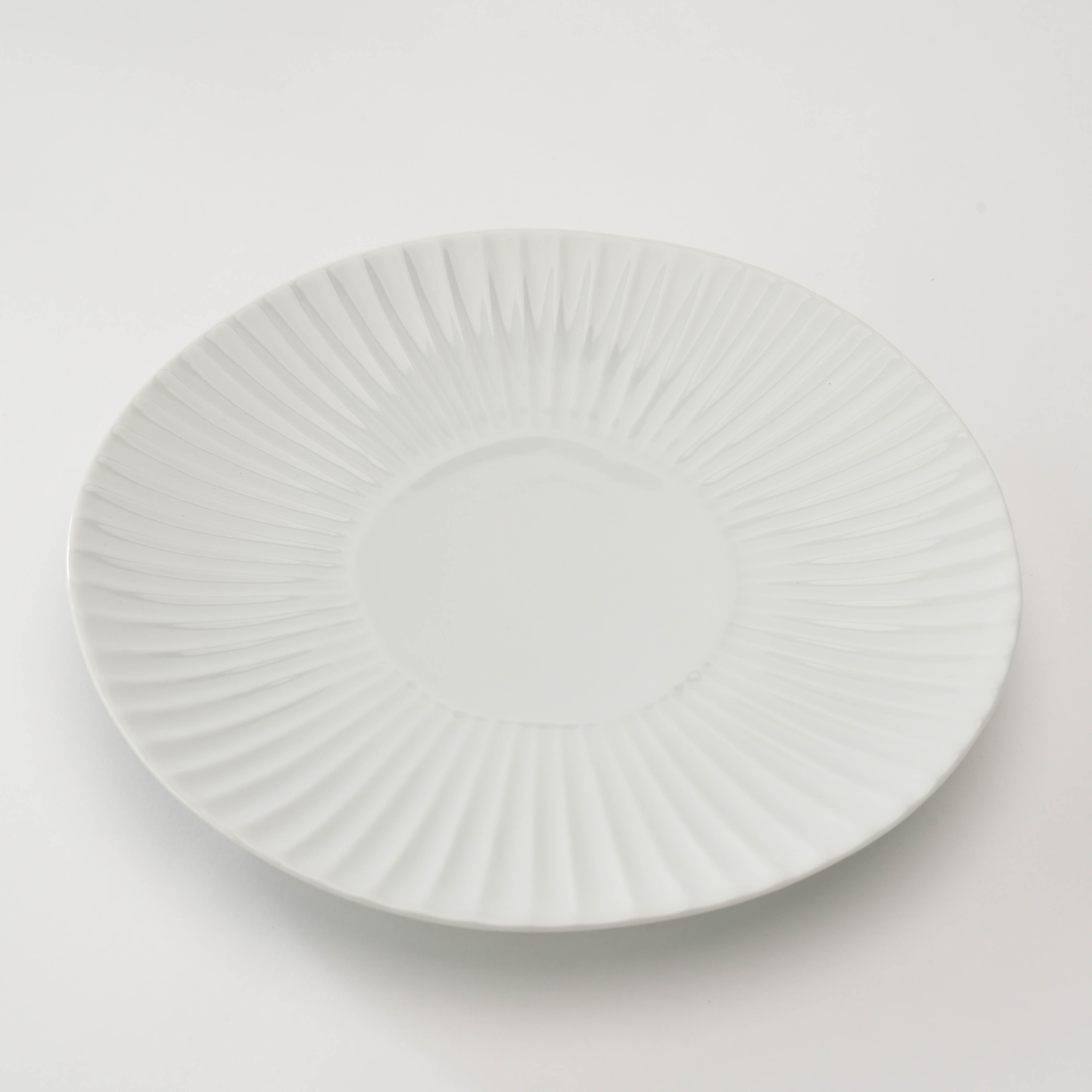 Top view of white Arita Ware Shinogi Medium Plate, featuring a clean radial pattern for serving appetizers or desserts with elegance.