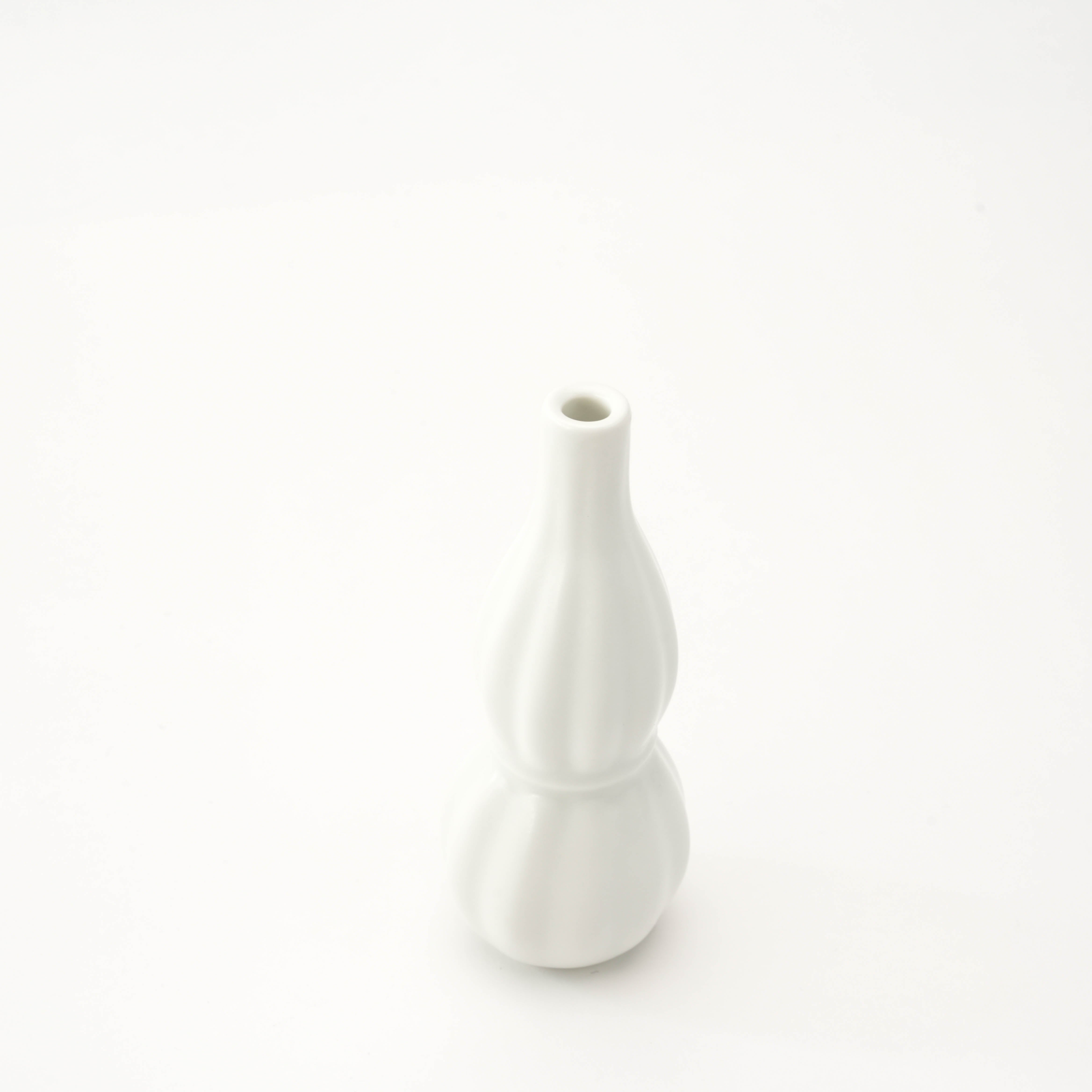 Top view of Arita Ware Flower Vase - Ribbed Ceramic showing narrow opening and smooth white finish, ideal for showcasing delicate blooms.
