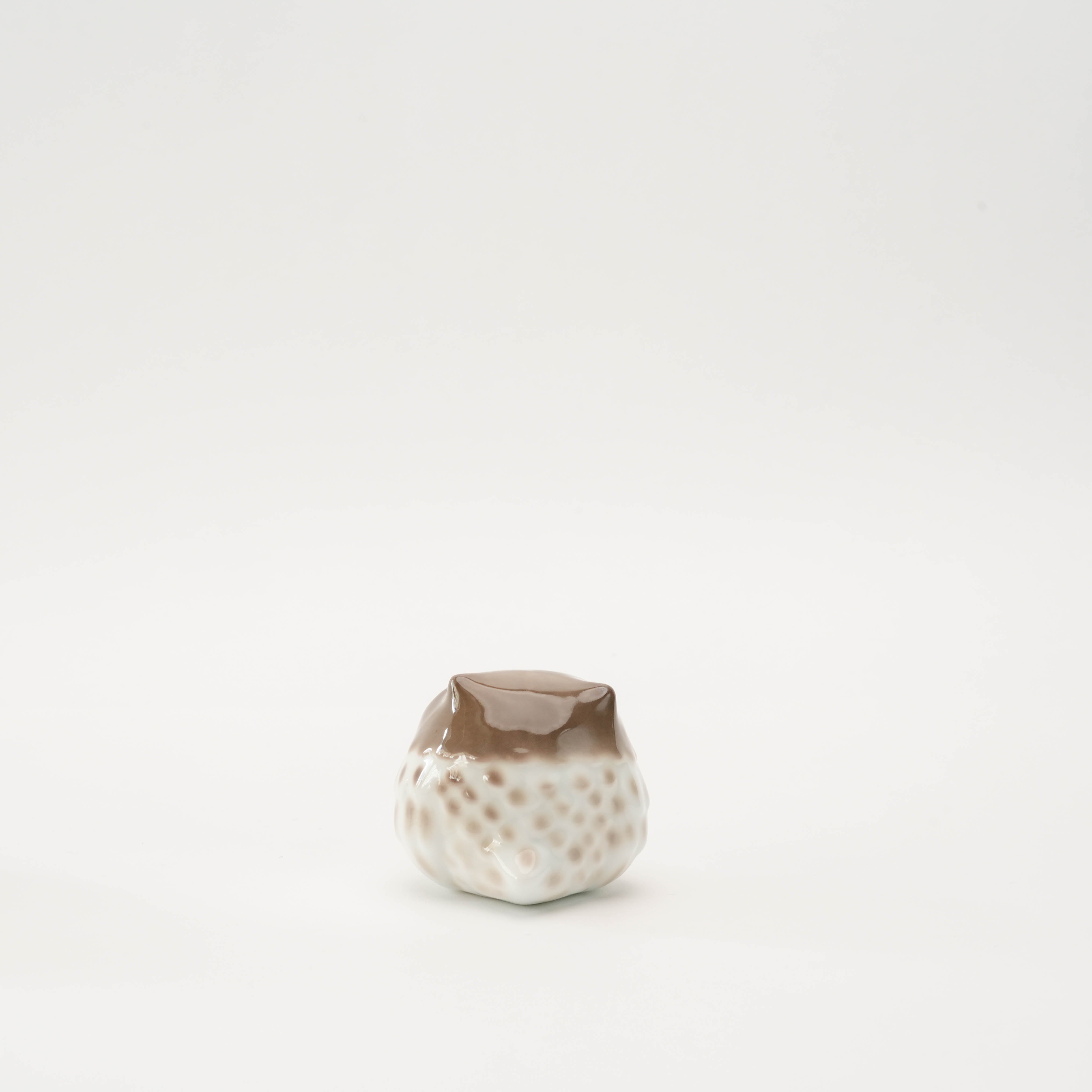 Back view of small Housuke Owl Ornament in Arita Ware ceramic, showing smooth brown glaze and rounded form.