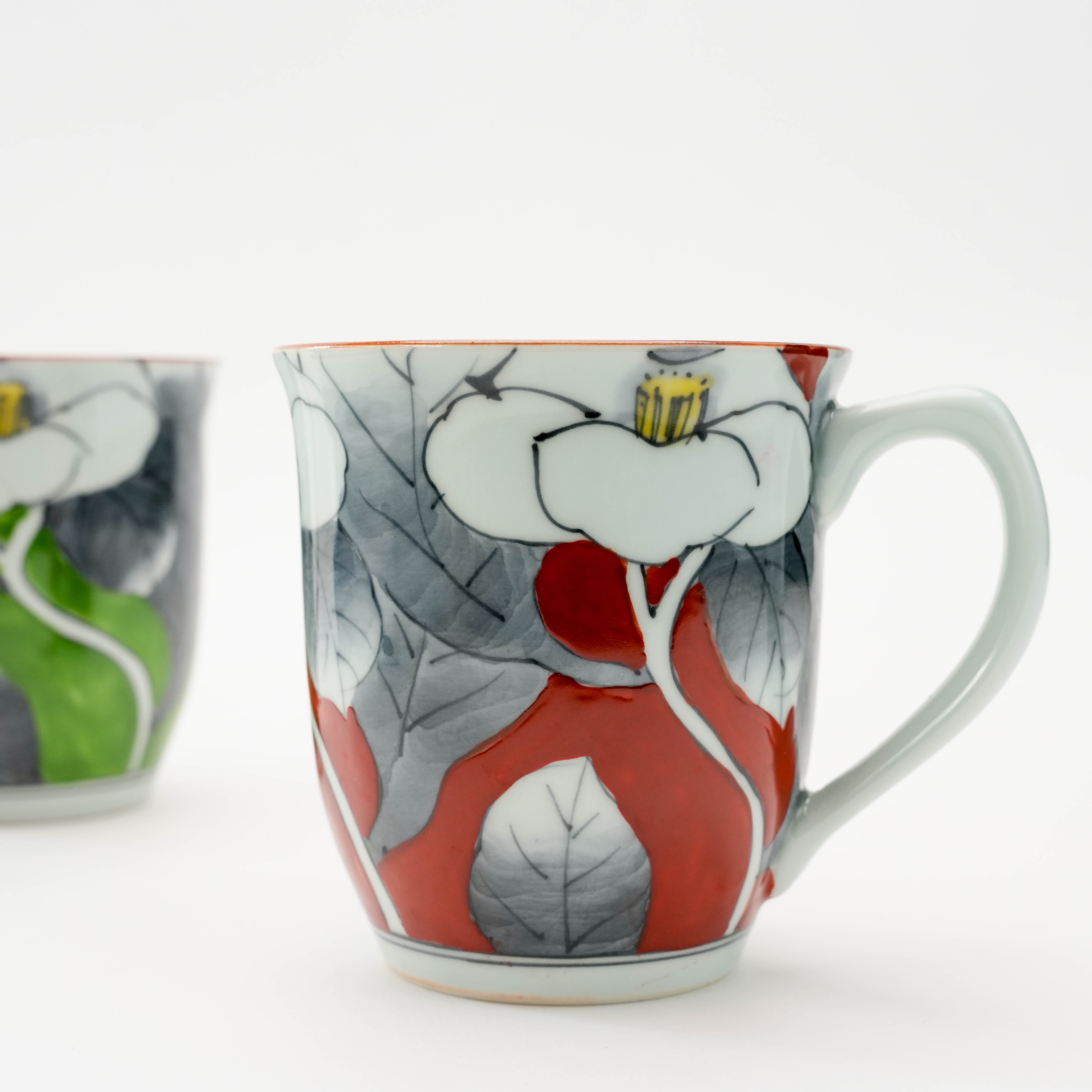 Close-up of red Arita Ware Sometsuke camellia mug with detailed floral pattern, ideal for gifting or enhancing traditional Japanese drinkware sets.