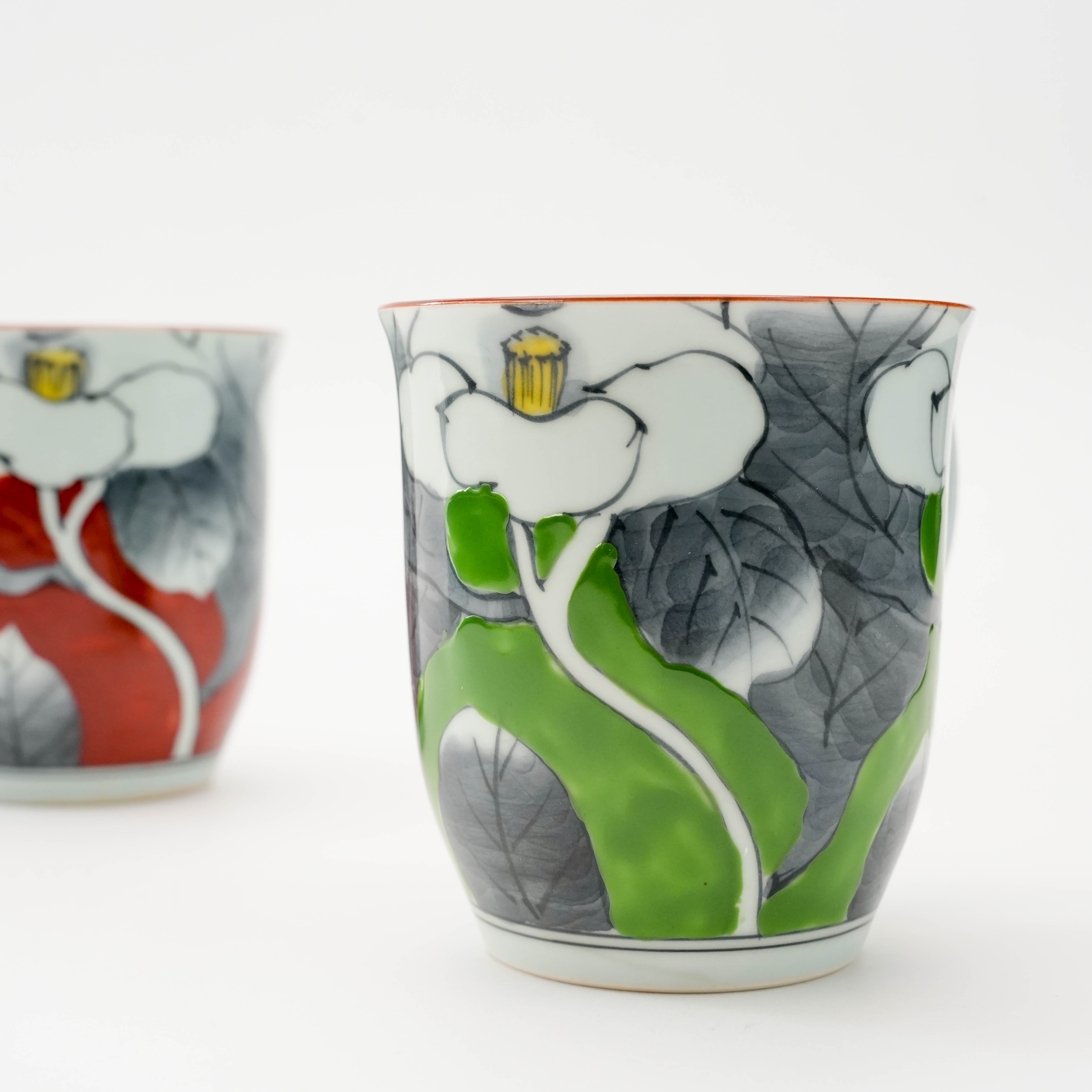 Close-up of green Arita Ware Sometsuke camellia mug, highlighting hand-painted floral design and premium Japanese ceramic quality.