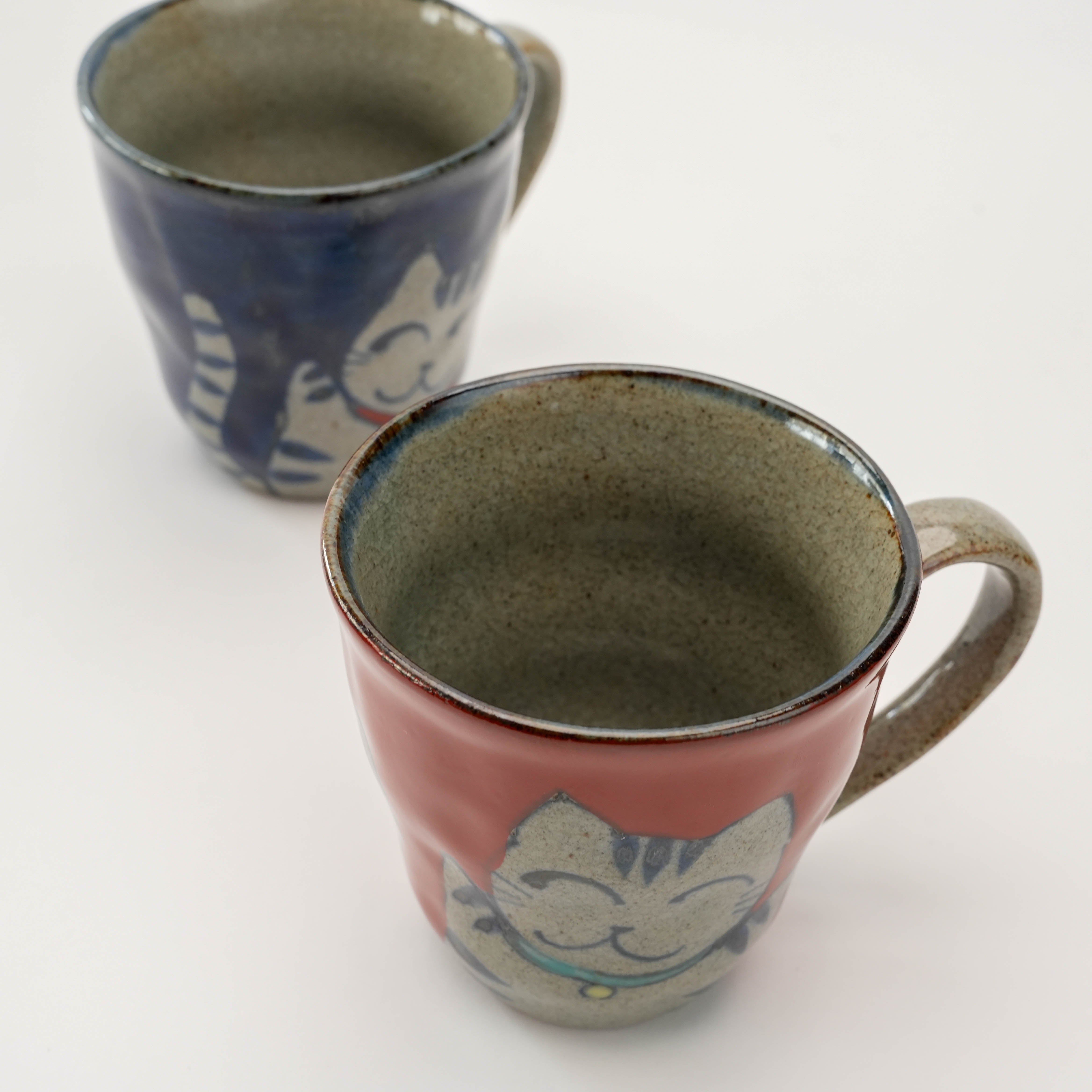 Top view of red Arita Ware Lucky Cat Mug with textured ceramic finish, ideal for gifting or enhancing your Japanese mug collection.