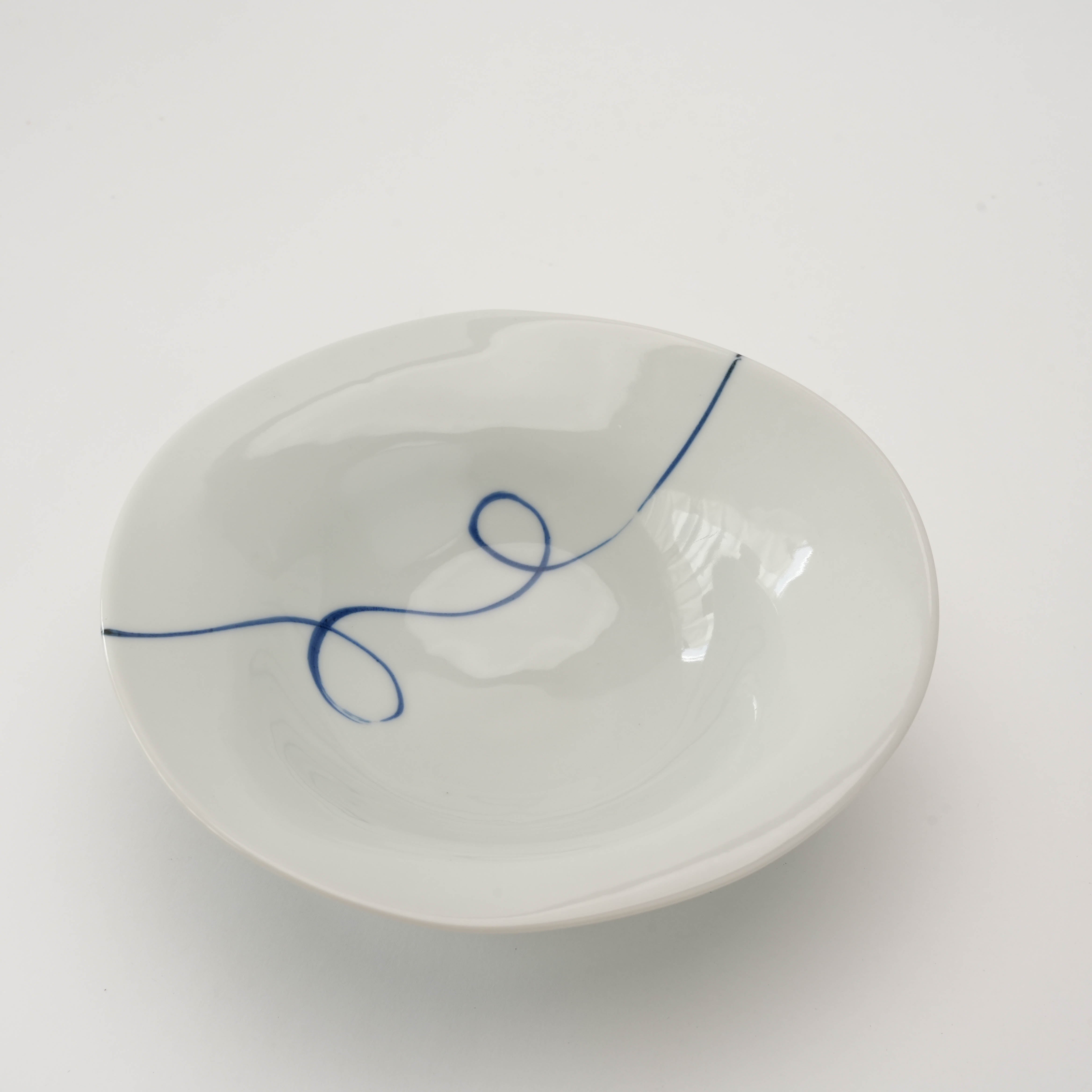 Arita Ware Twisted Small Bowl with elegant curved rim and indigo thread motif, crafted for stylish presentation of side dishes or snacks.