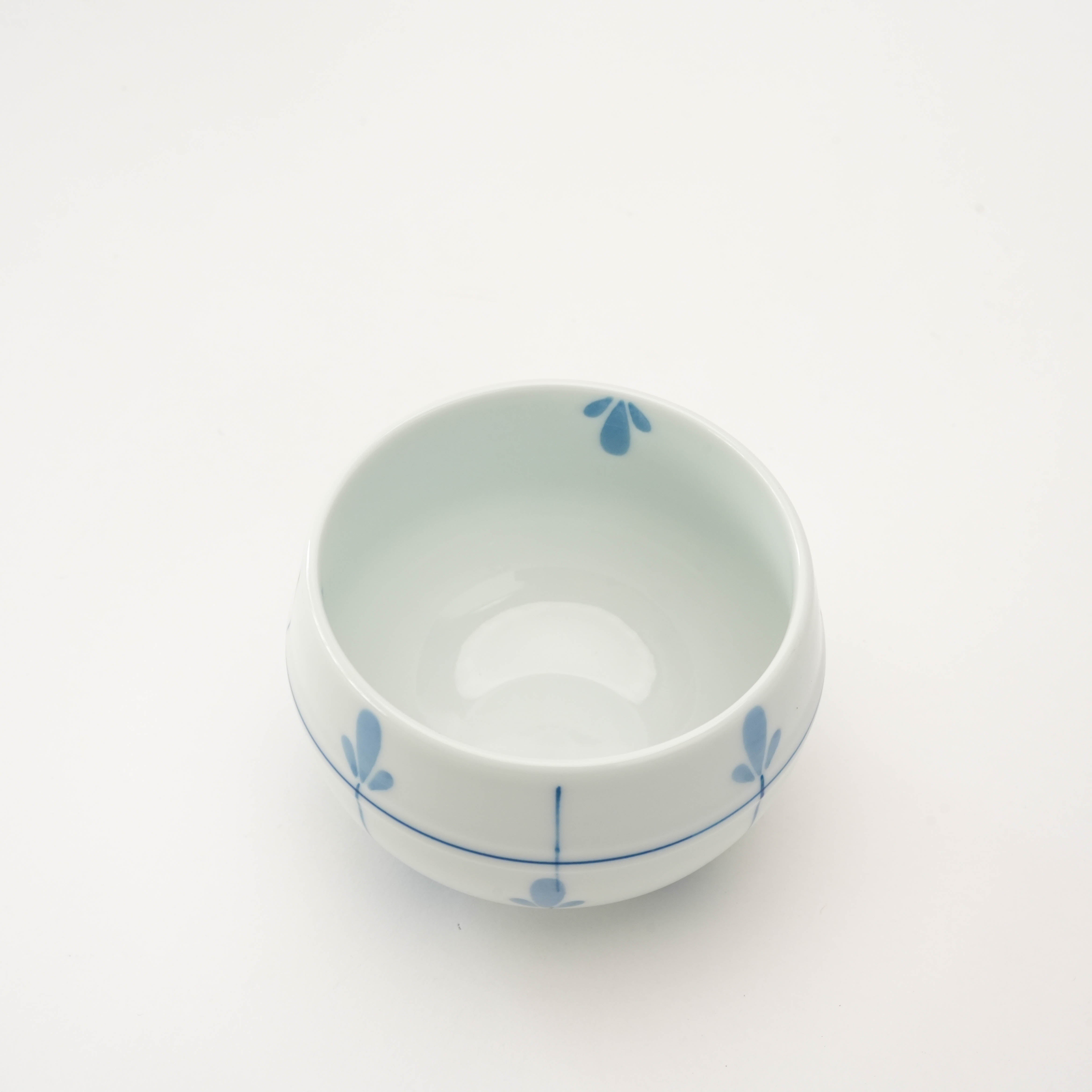 Top view of Arita Sencha Tea Cup - Sprout Design reveals smooth interior and symmetrical blue sprout detailing, perfect for tea lovers.