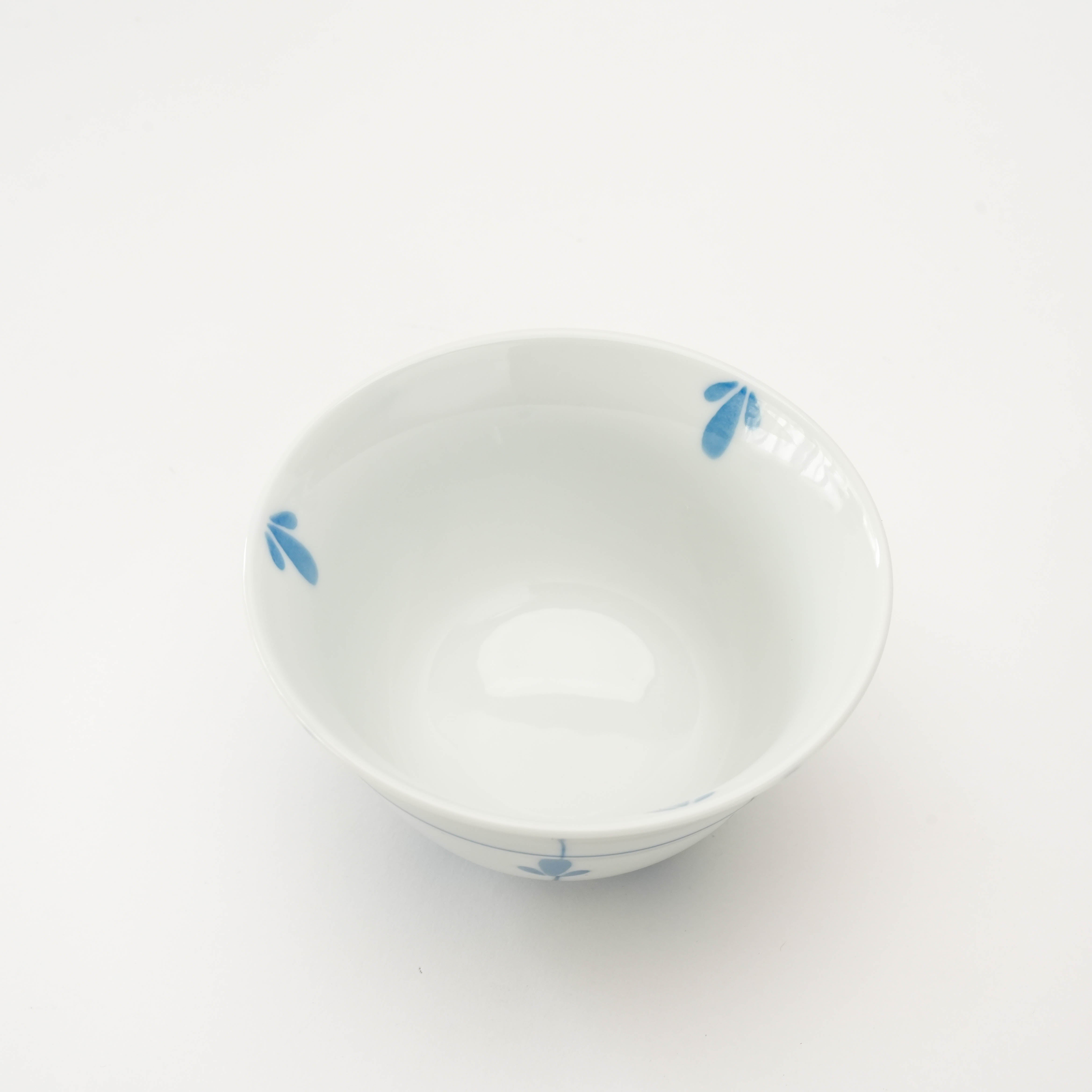 Top view of Arita Ware Sprout Sencha Tea Cup revealing smooth white interior with subtle blue sprout accents. Perfect for tea lovers.