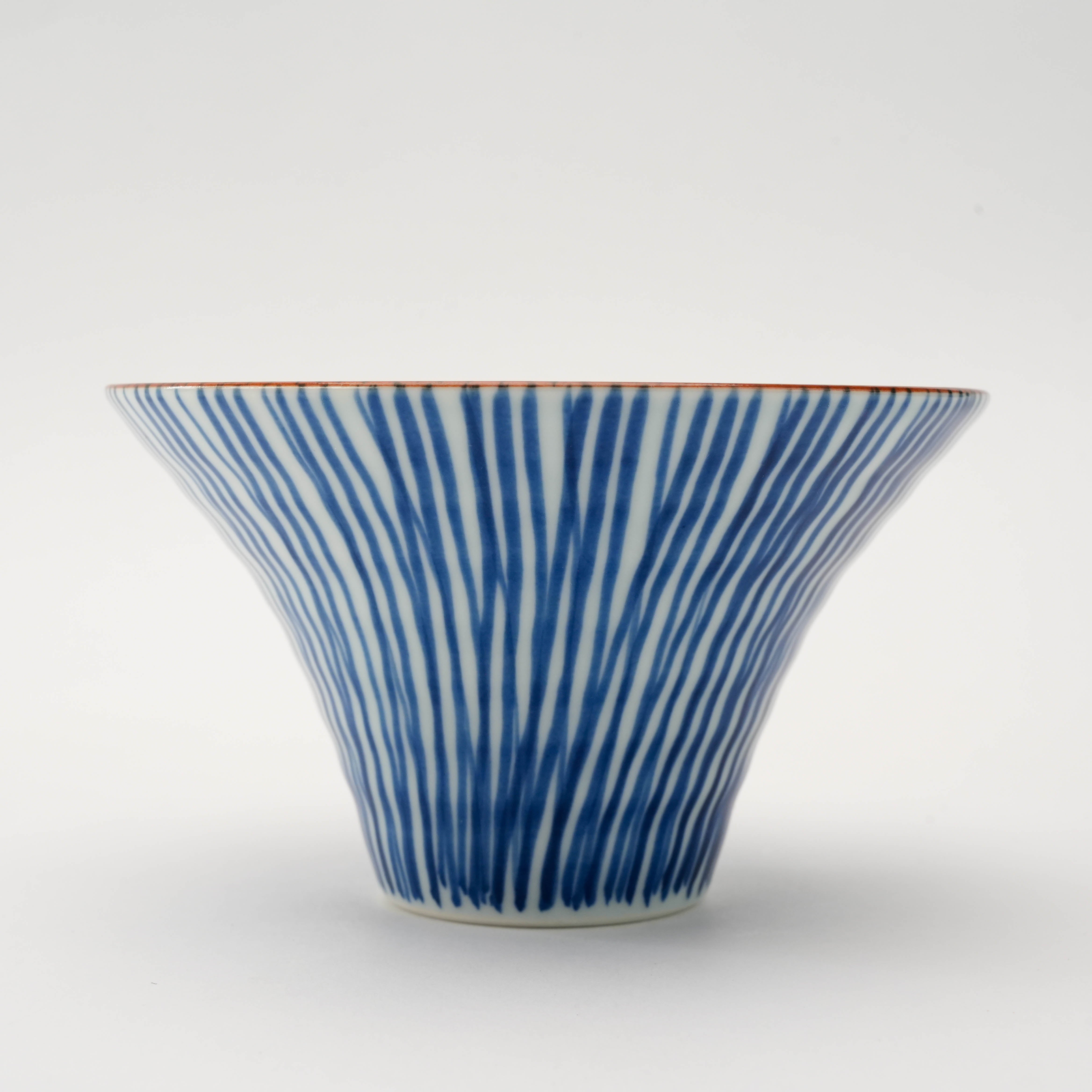 Side view of blue Arita Ware Flared Bowl - Small Bowl | 12cm Hand-Painted with fine Tokusa brushstroke pattern and flared silhouette.