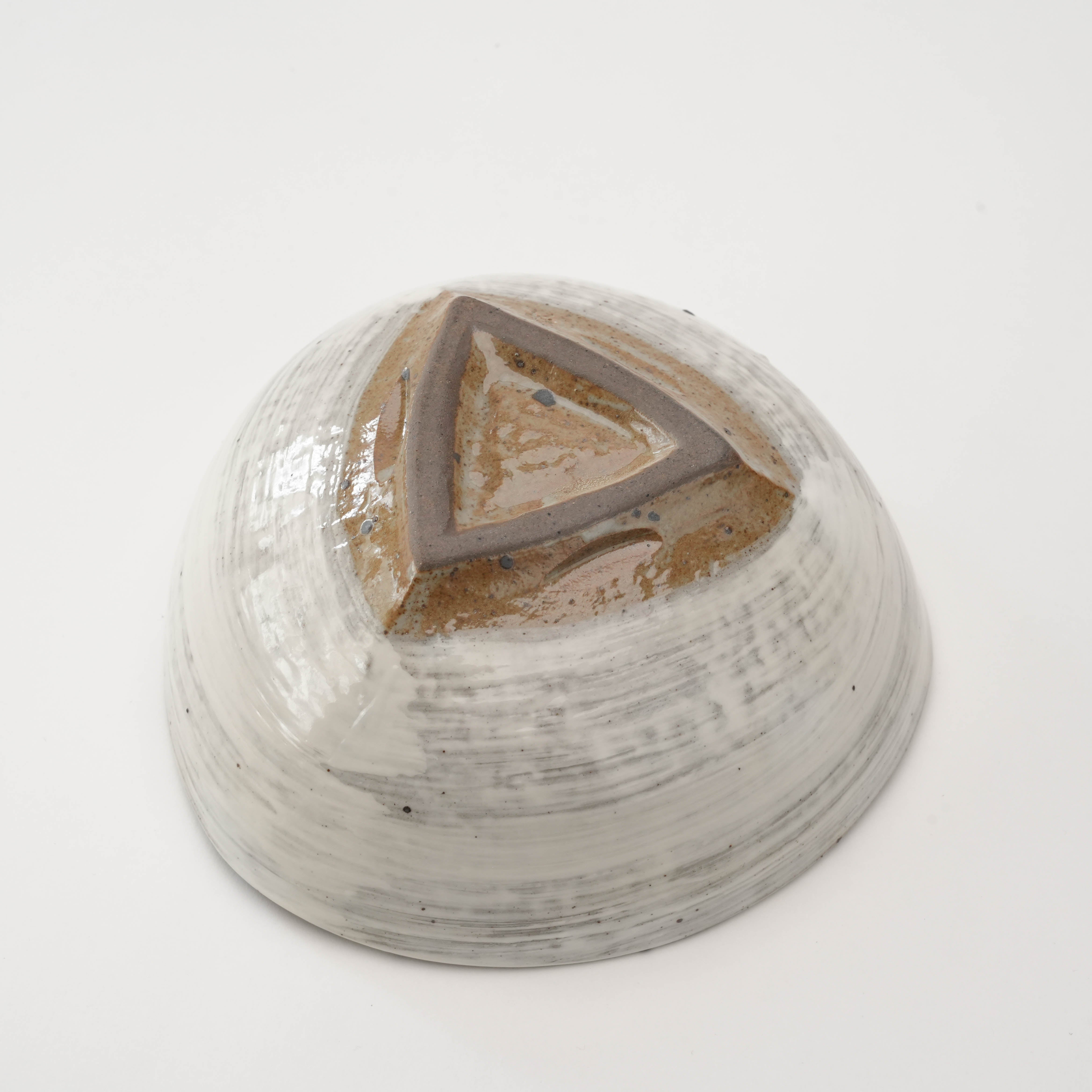 Bottom view of Kimikage Triangular Bowl showing its raw clay triangular base and handcrafted detailing, a stylish addition to kitchenware.