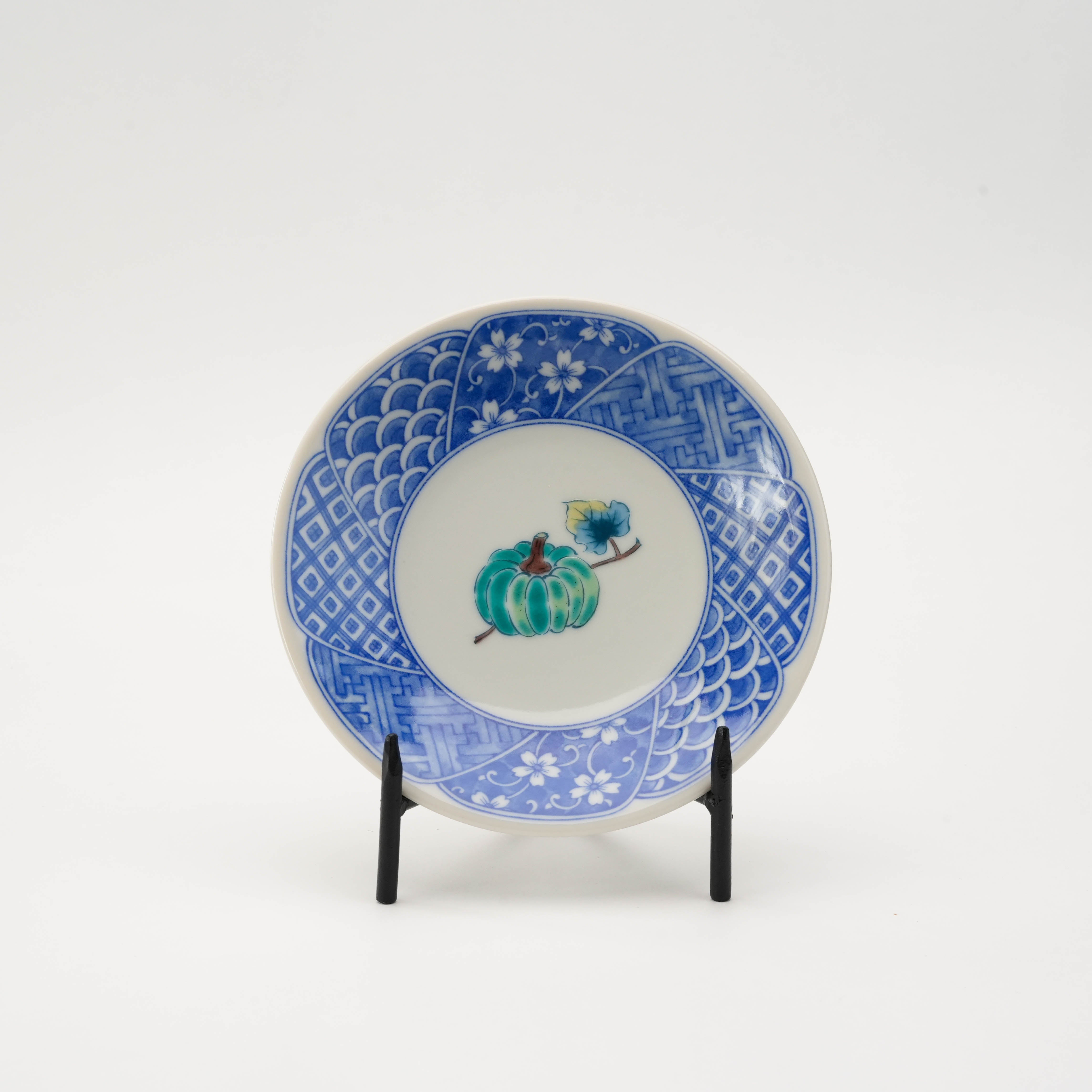 Blue-rimmed Kutani Ware plate with green pumpkin design, one of five unique vegetable illustrations in the small plate set.
