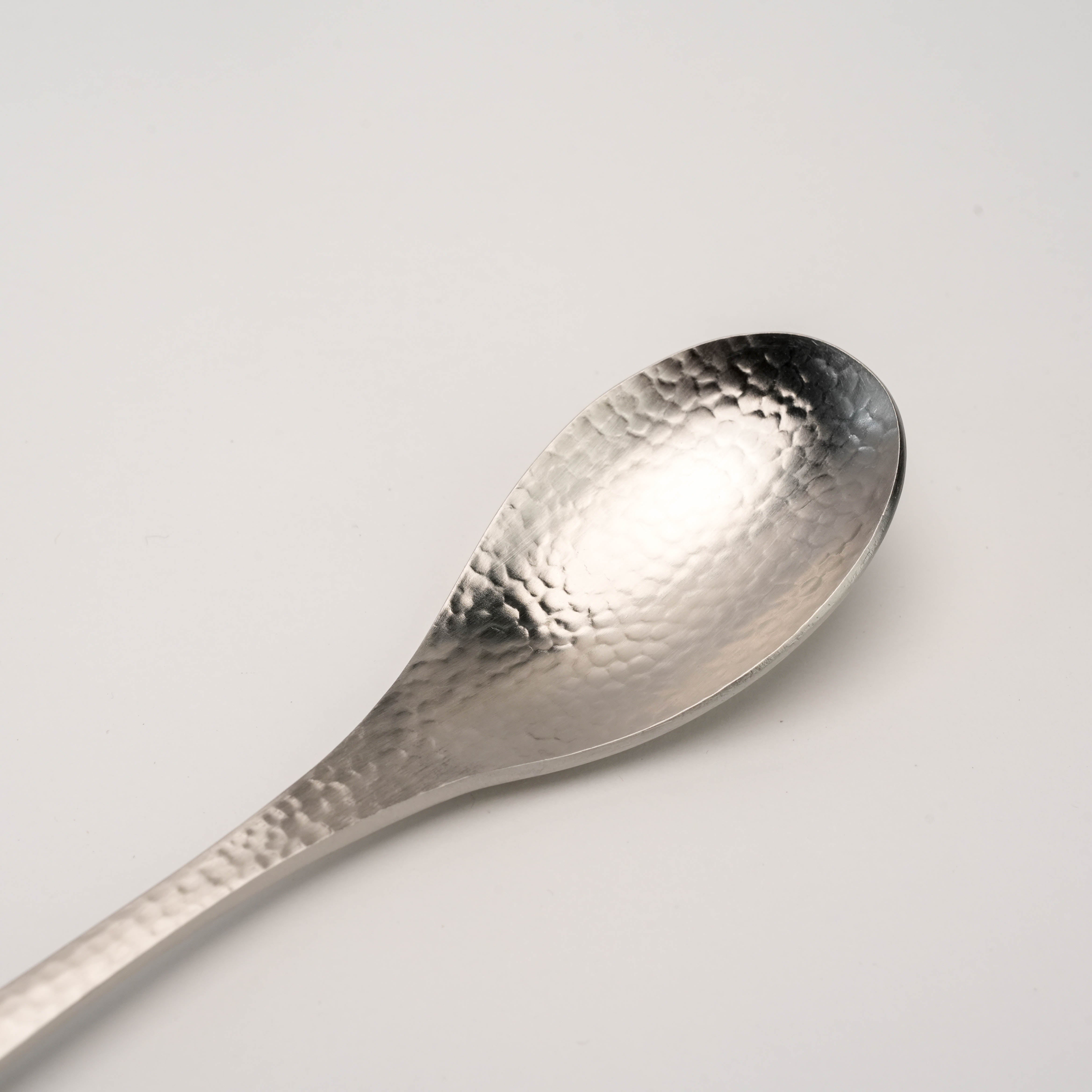 Close-up of Tsubamesanjo Spoon - Hammered Finish showcasing detailed Japanese craftsmanship and textured metal surface for refined tableware.