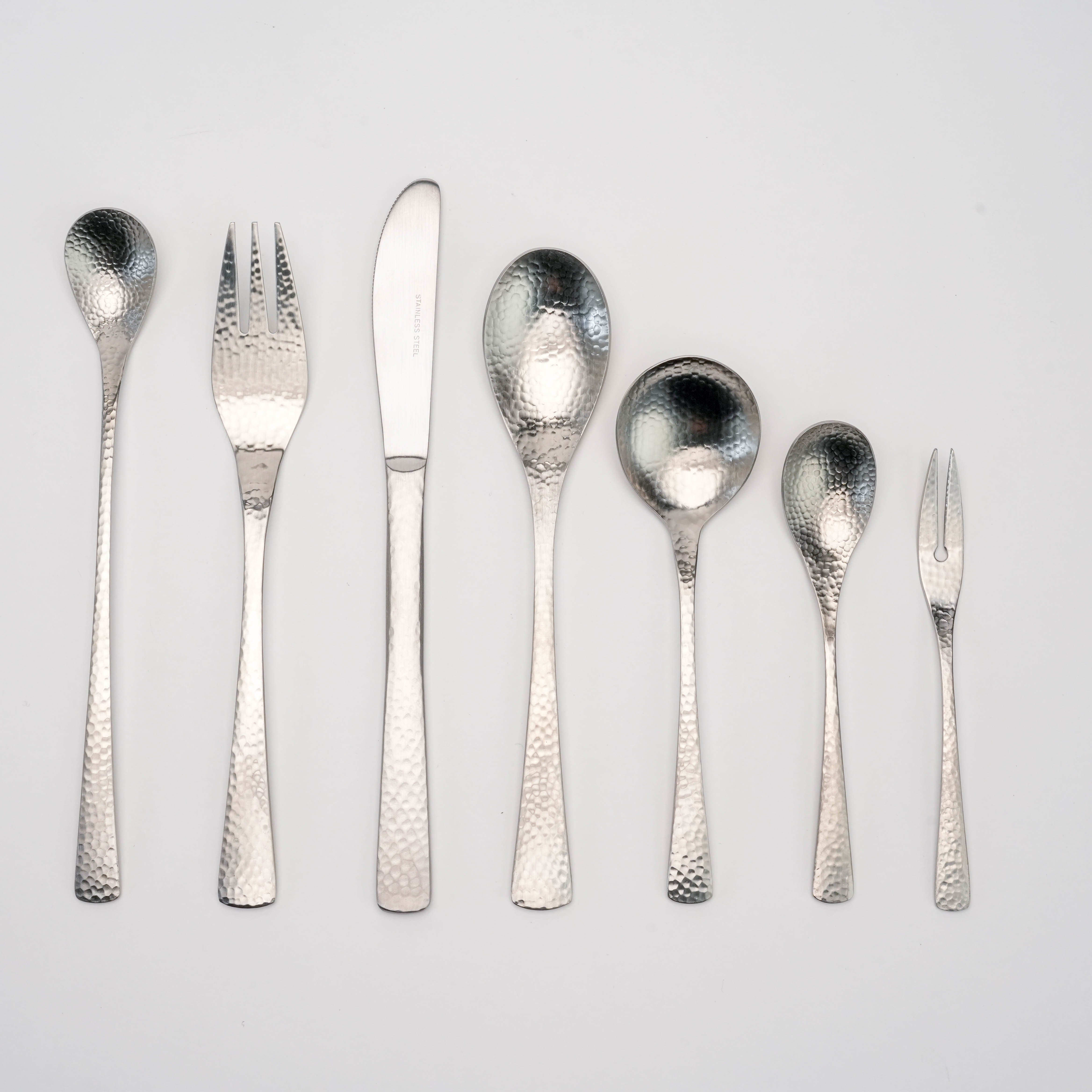 Complete set featuring the Nagomi Wafu Hammered Soup Spoon among matching hammered flatware, ideal for cohesive Japanese-inspired table settings.