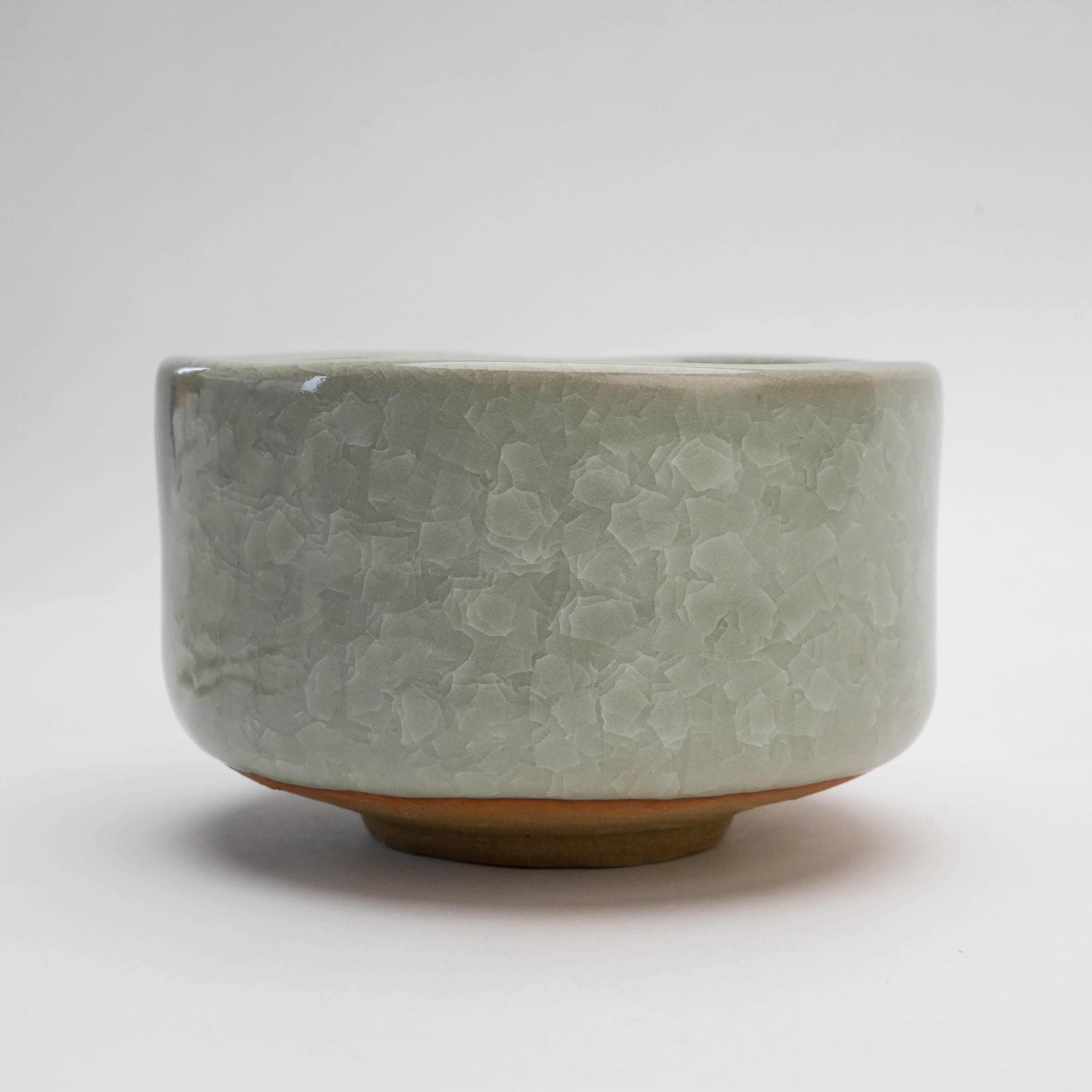 Side profile of Mino Ware Matcha Bowl - White Kan-iri featuring a frosty crackle glaze and elevated foot for stable grip.
