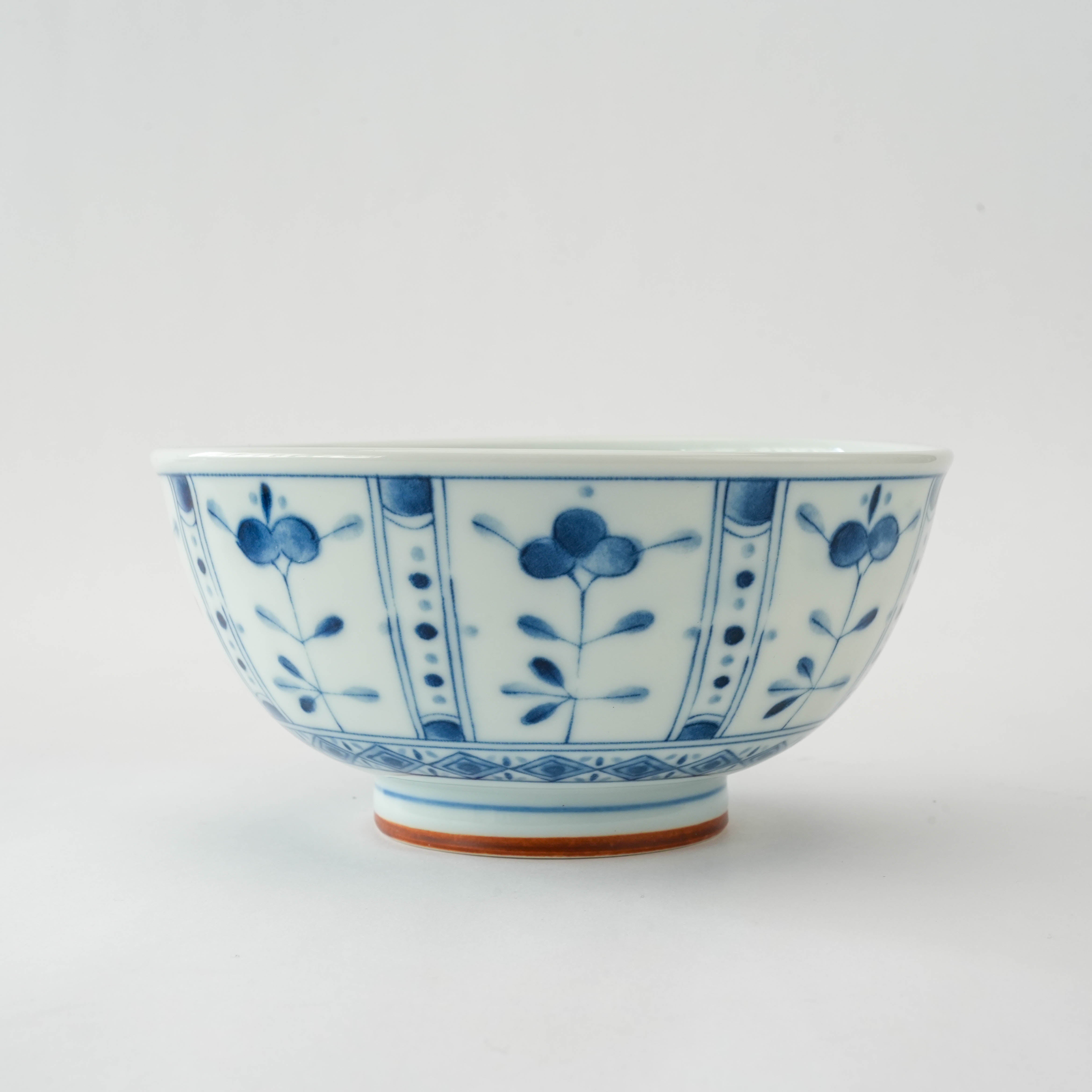 Traditional Rin Tachibana Donburi Bowl showcasing detailed blue floral patterns, ideal for serving in refined Japanese dining settings.