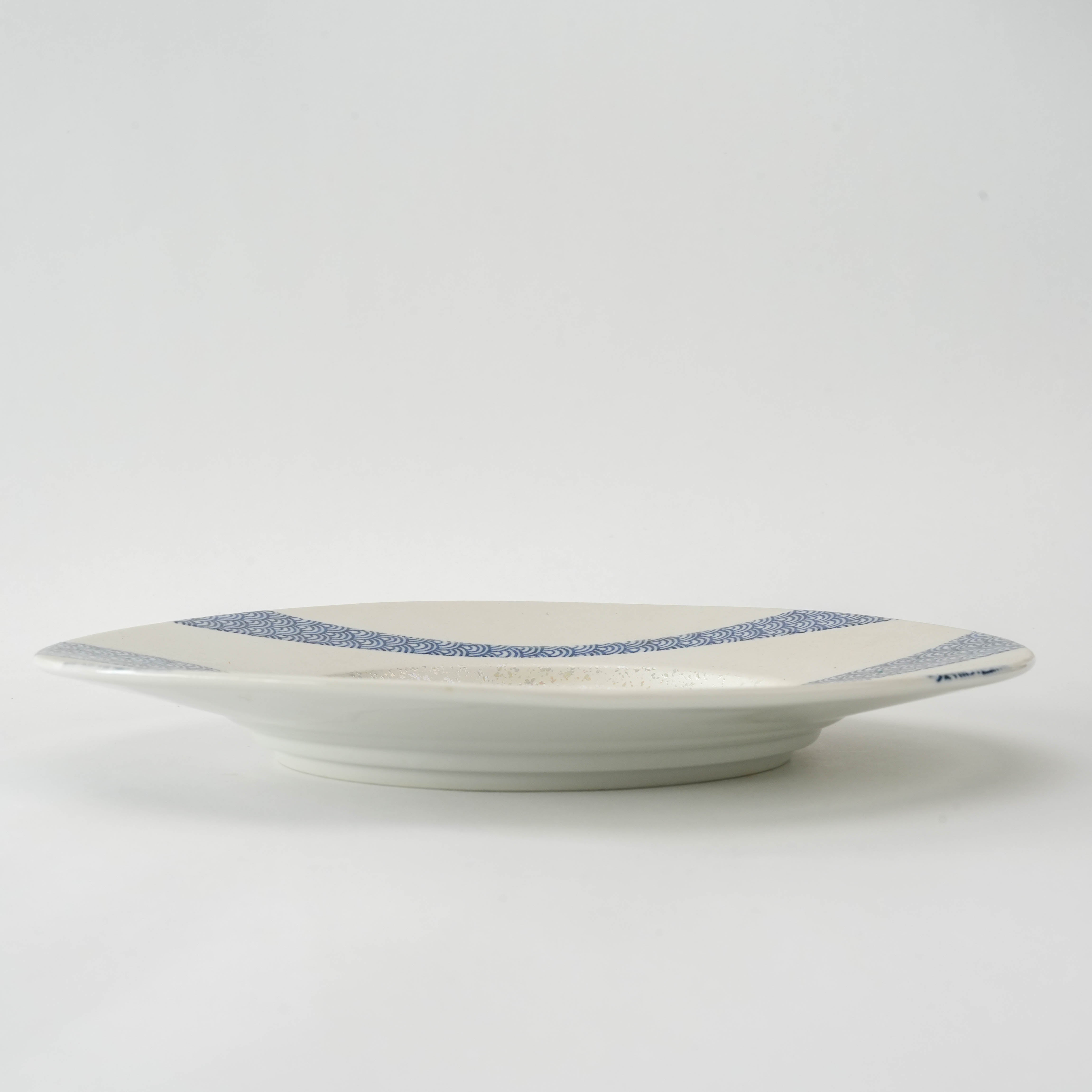 Side view of Mino Ware Seigaiha Plate - Luster Round Plate | 24cm showing shallow depth and smooth ceramic finish with wave motif.