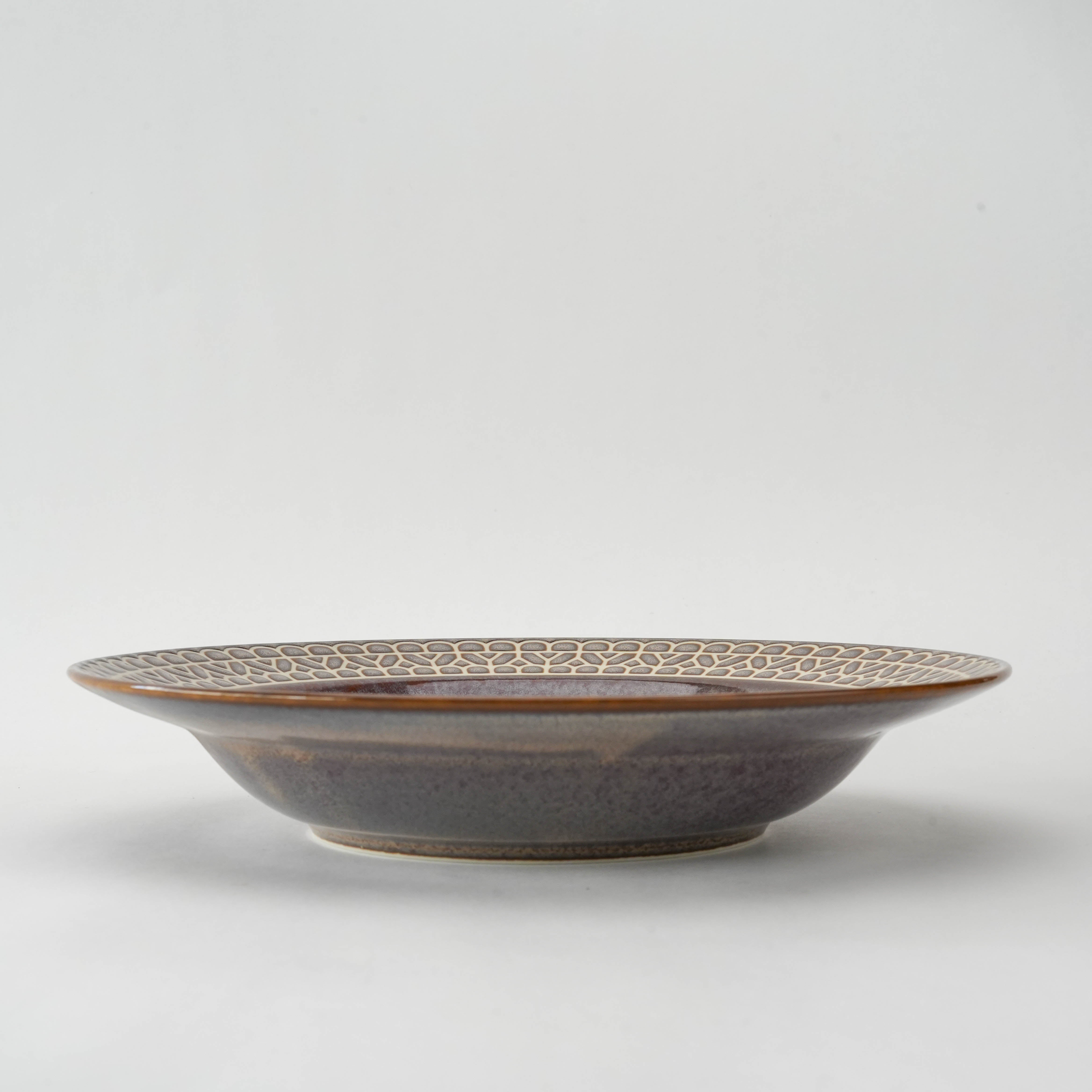 Side view of Mino Ware Coupe Plate - Brown Rim Lace, 23.5 cm, showcasing its shallow depth and artisan-crafted textured rim.