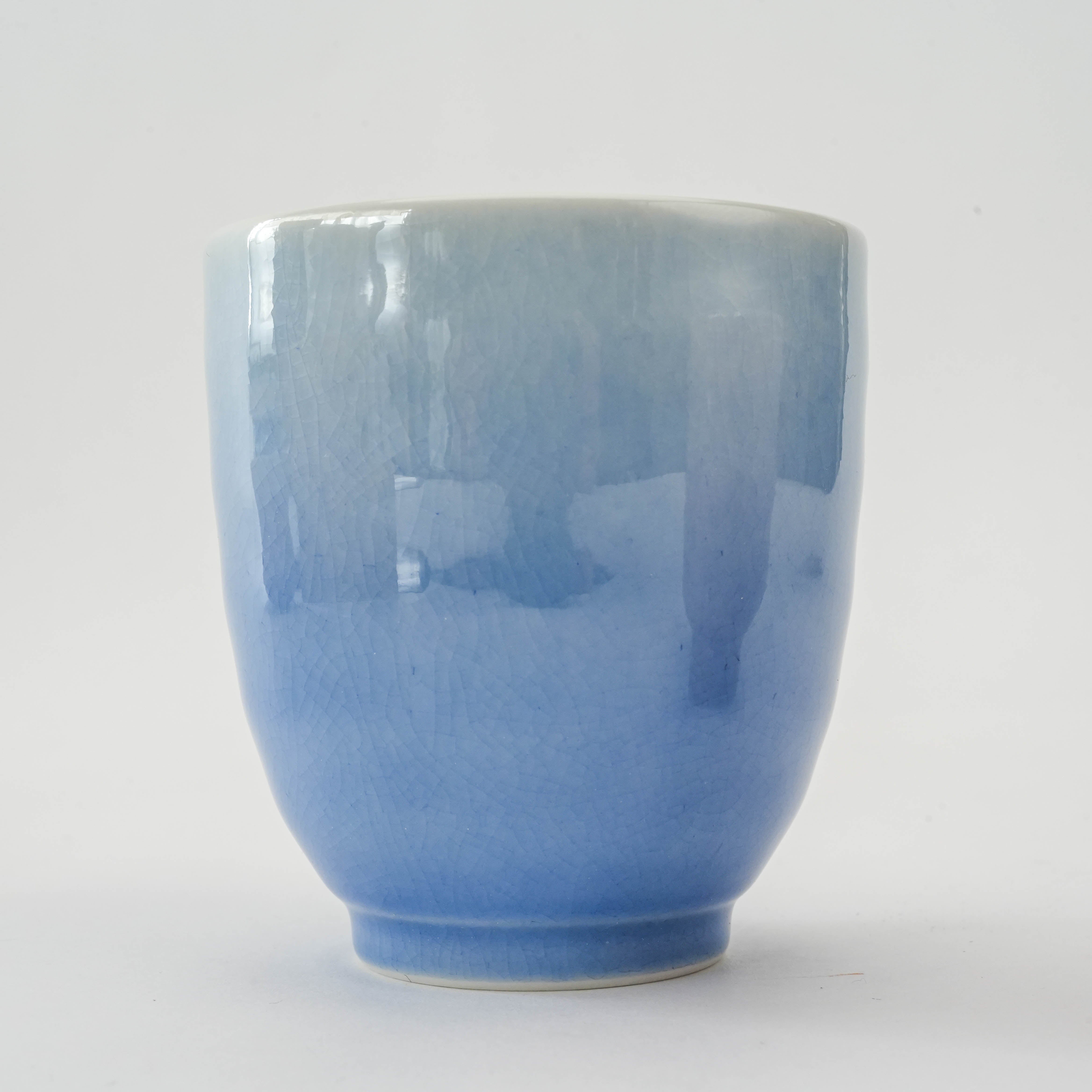 Close-up of blue tea cup from Kutani Ware Dinner Set - Blue Pink Porcelain | Kutani Craft, highlighting the smooth porcelain finish and gradient glaze.